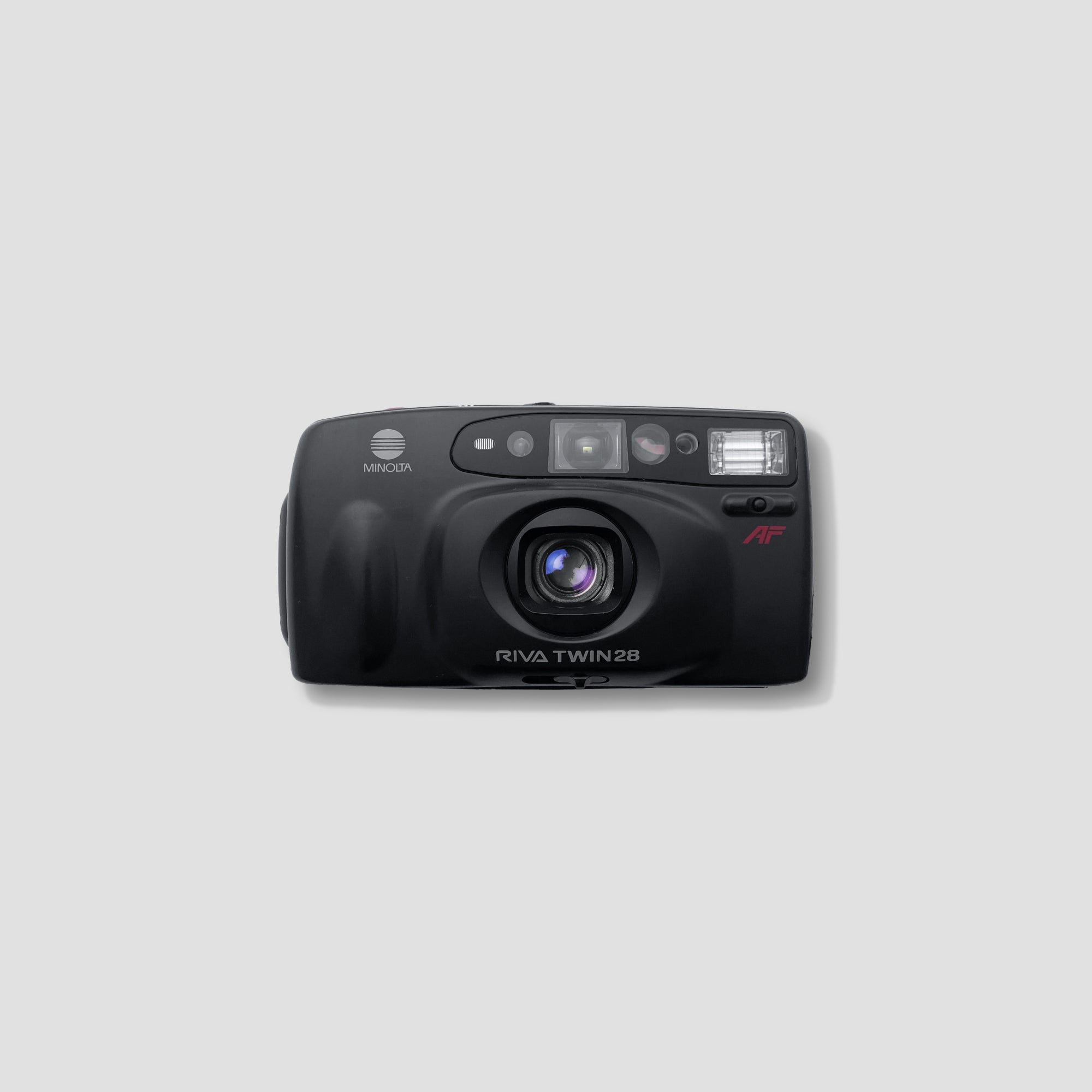 Close-up of the Minolta Riva Twin 28 showcasing its dual lens system and sleek design.