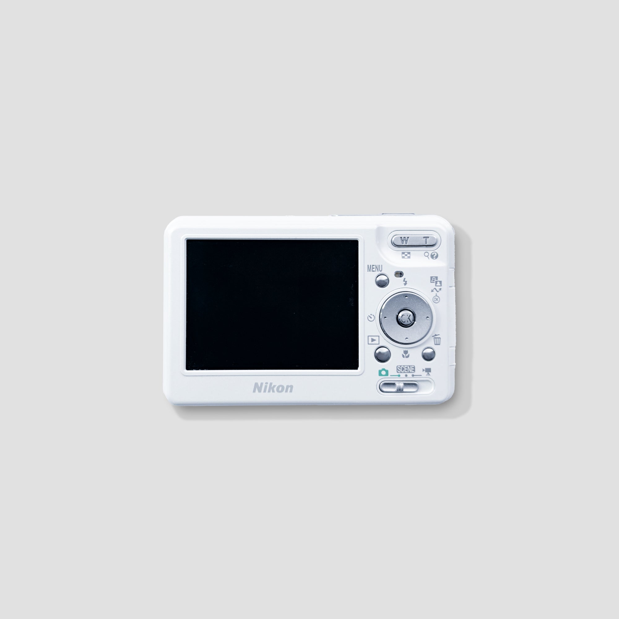 Nikon Coolpix S1 in hand during travel, demonstrating its lightweight and portable build