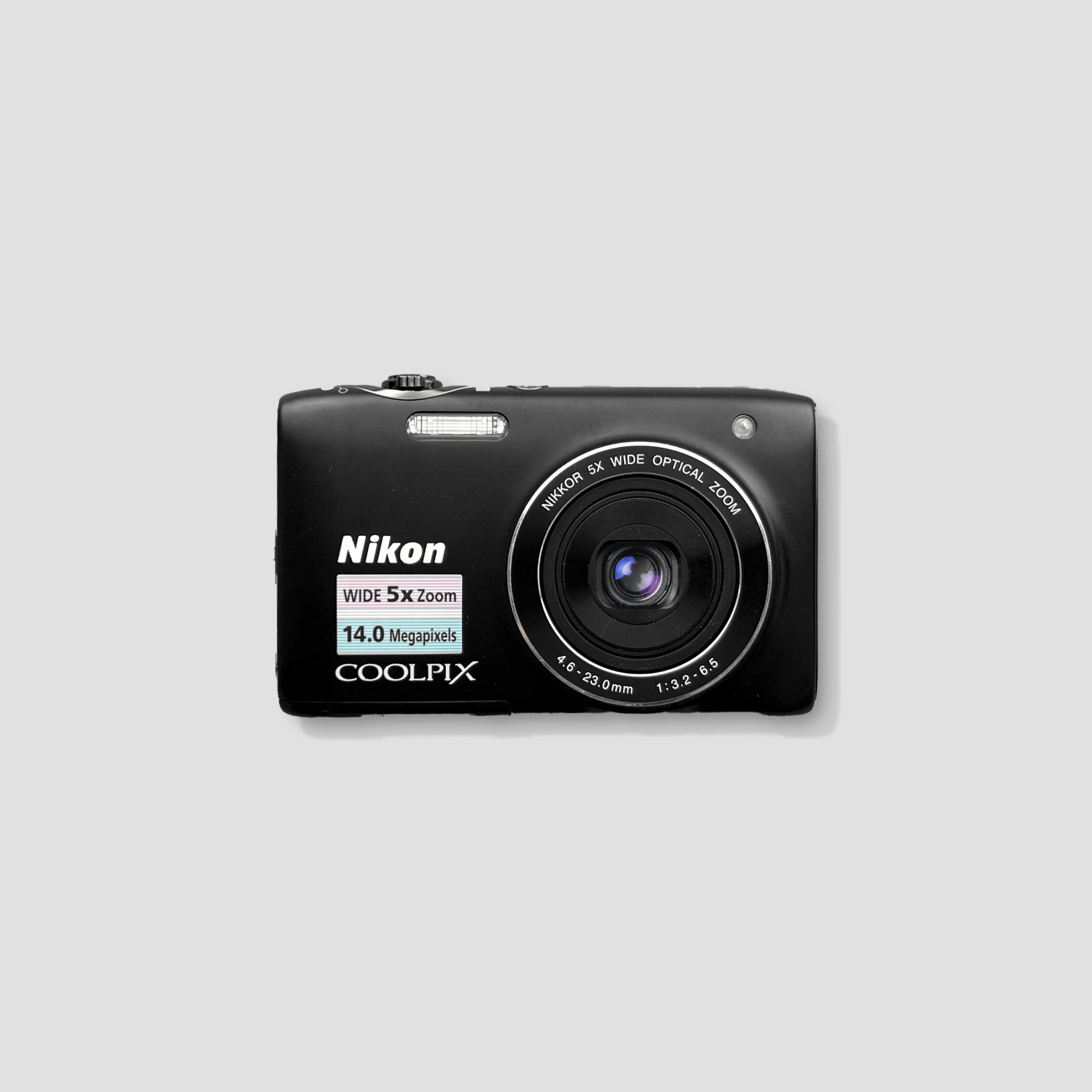 Nikon Coolpix S3100 showing its 5x optical zoom lens, ideal for capturing distant subjects.