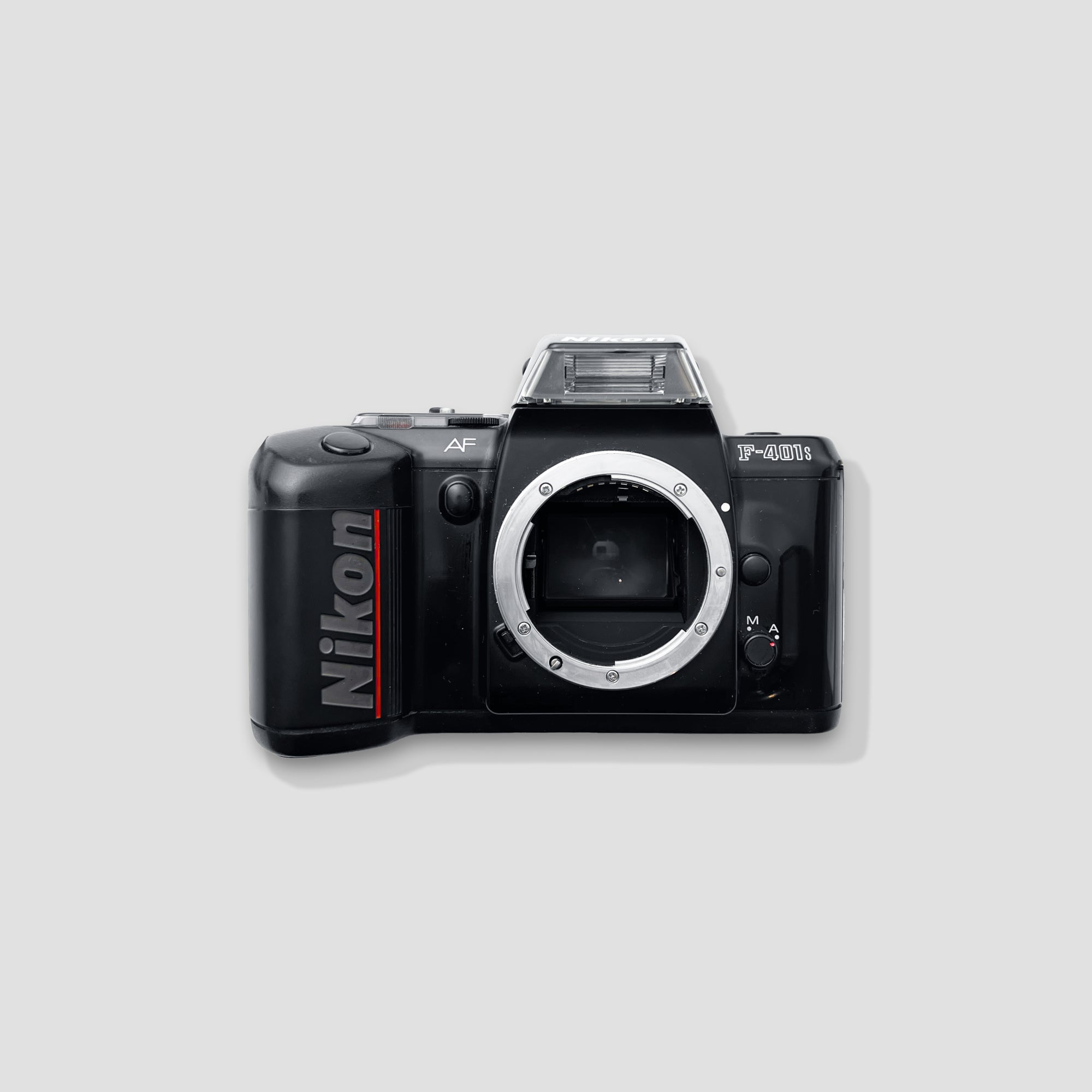 Nikon F-401s SLR camera front view, showcasing its classic design and film compartment.