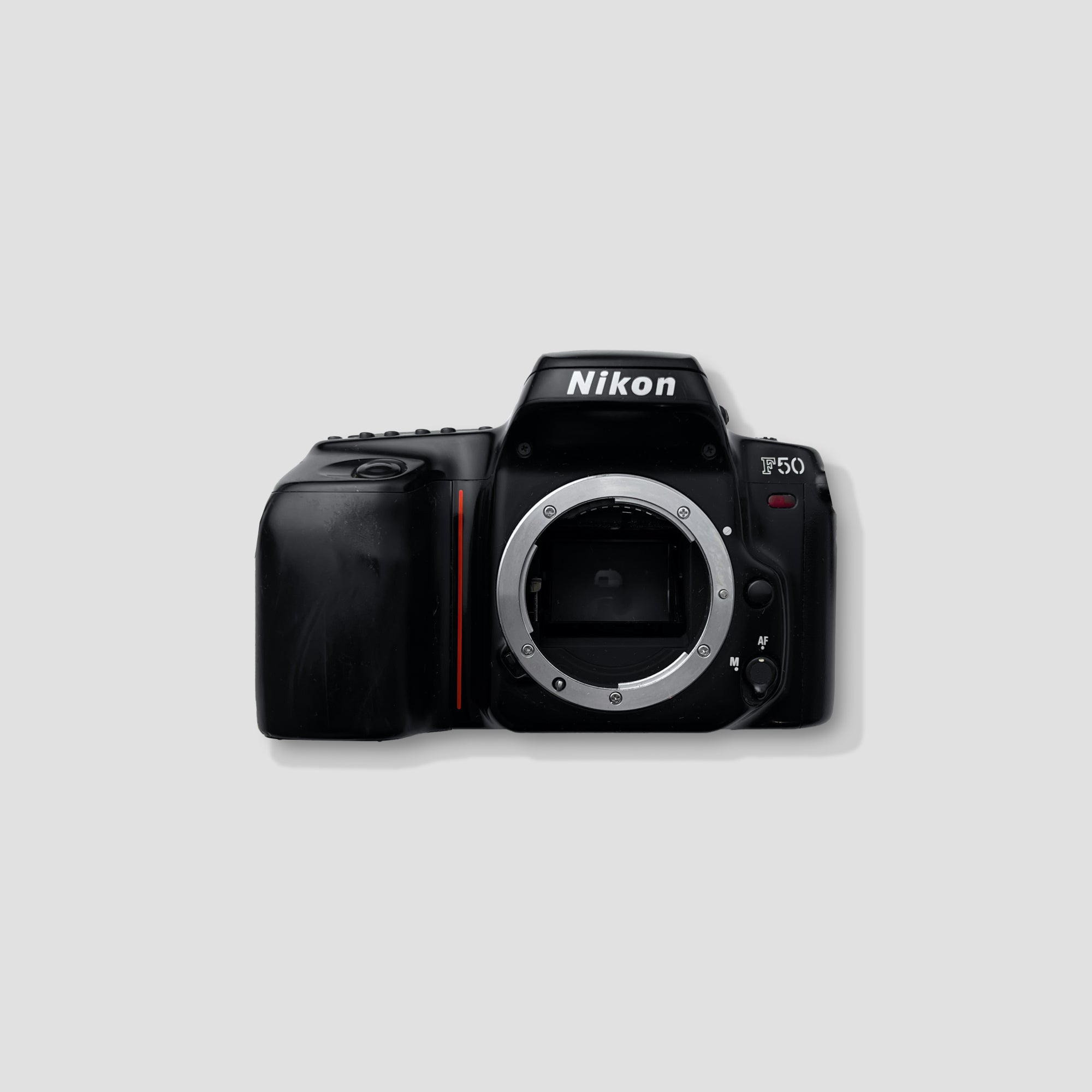 Front angle of Nikon F50 showing lens mount and mode dial – Nikon camera for beginners