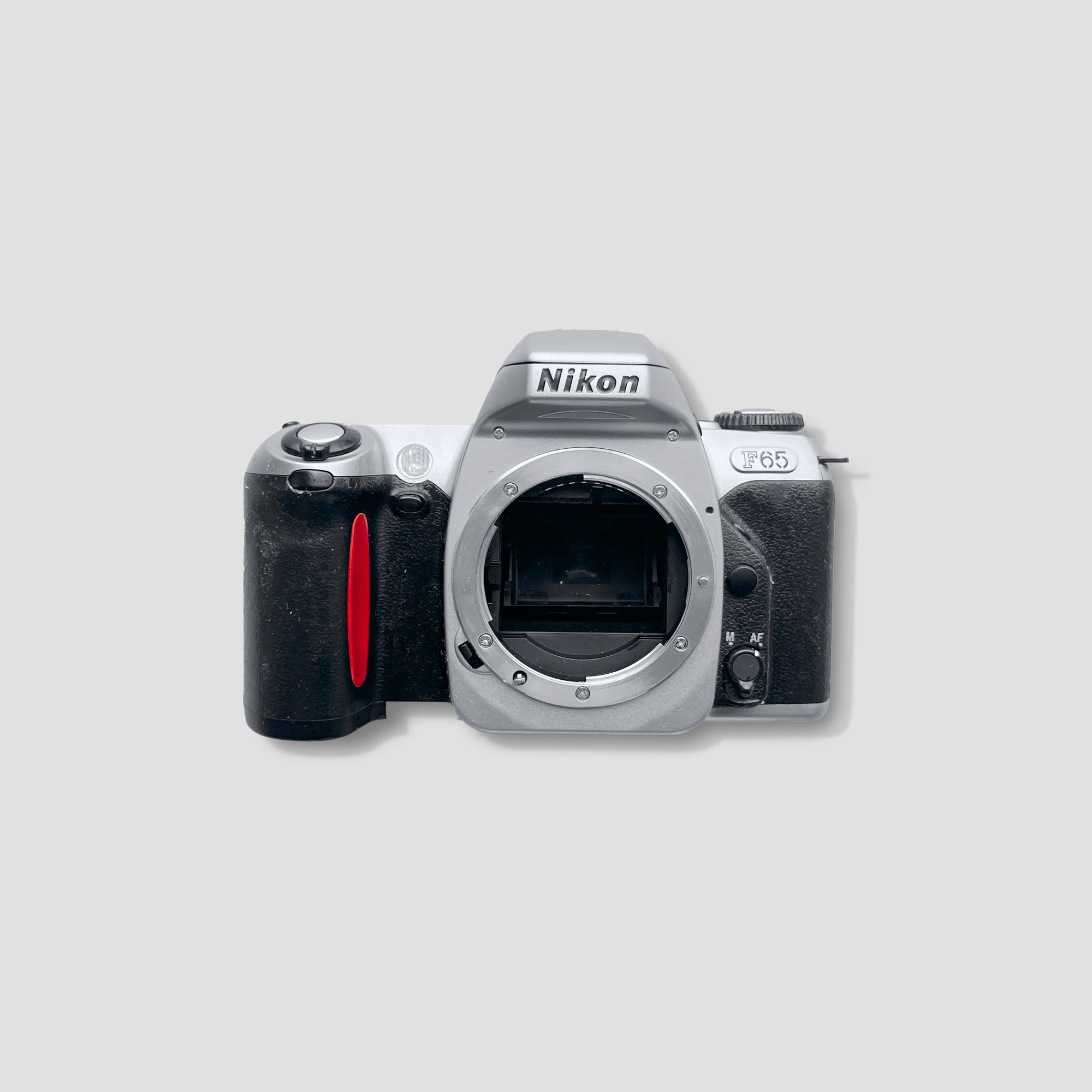 Nikon F65 SLR camera showing autofocus feature and LCD screen