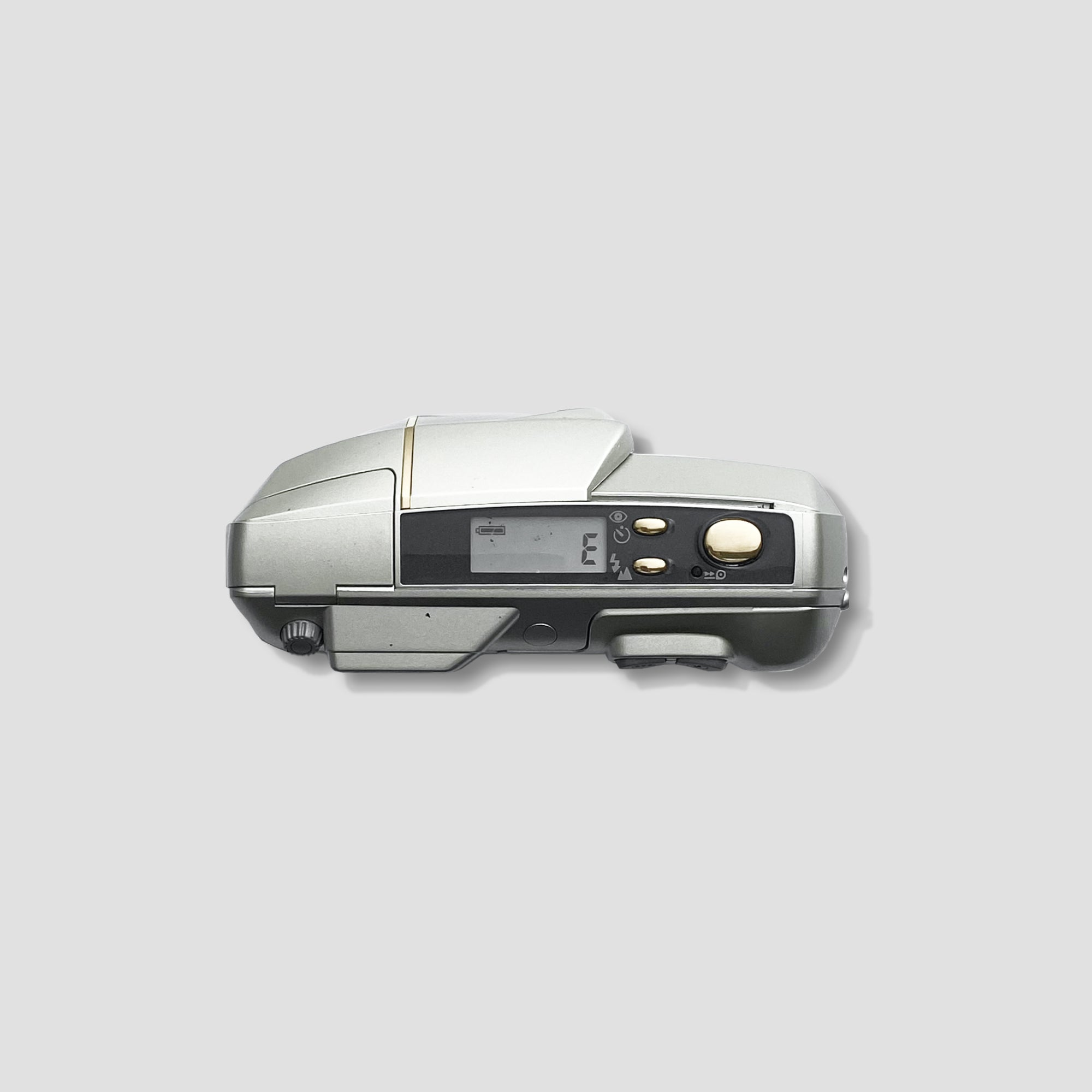 Close-up of the zoom lens on a compact film camera for travel