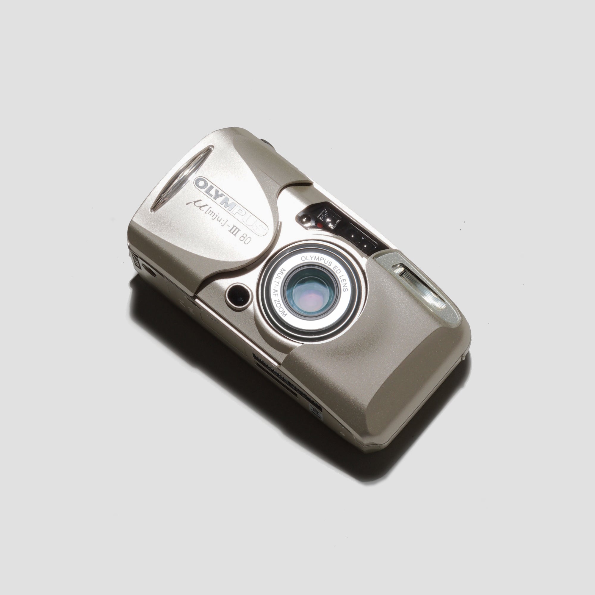 Olympus MJU III Zoom 80 with zoom lens extended, perfect for capturing travel moments.