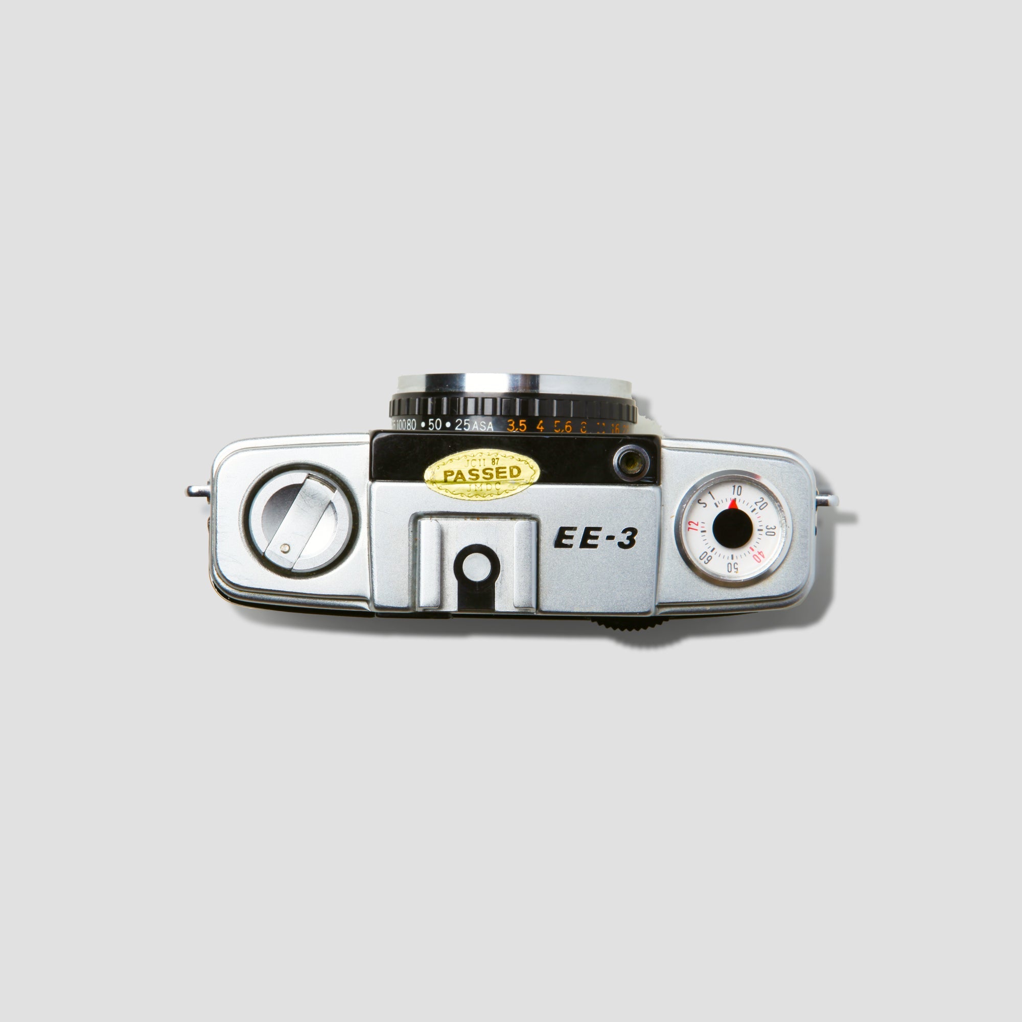 Olympus Pen EE-3 vintage half-frame film camera from the front angle