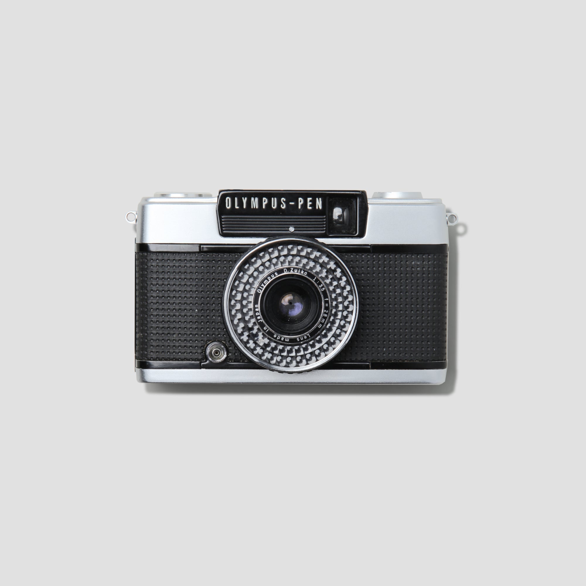 Olympus Pen EE-3 vintage half-frame film camera from the front angle