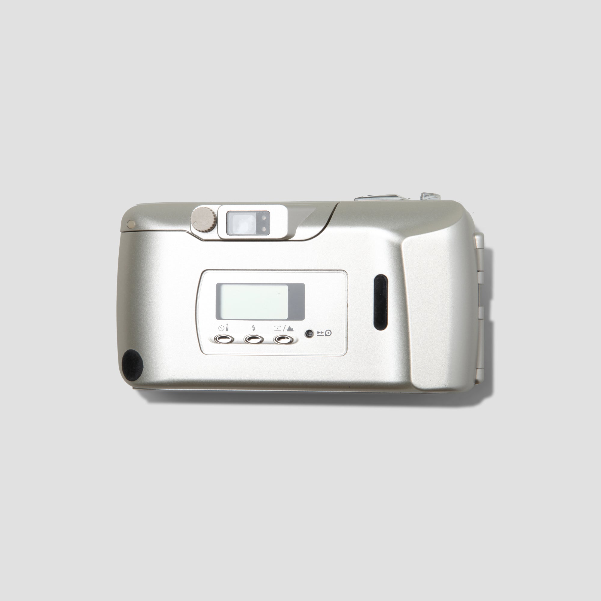 User  holding Olympus MJU III Zoom 120 in an outdoor setting, capturing memorable moments.