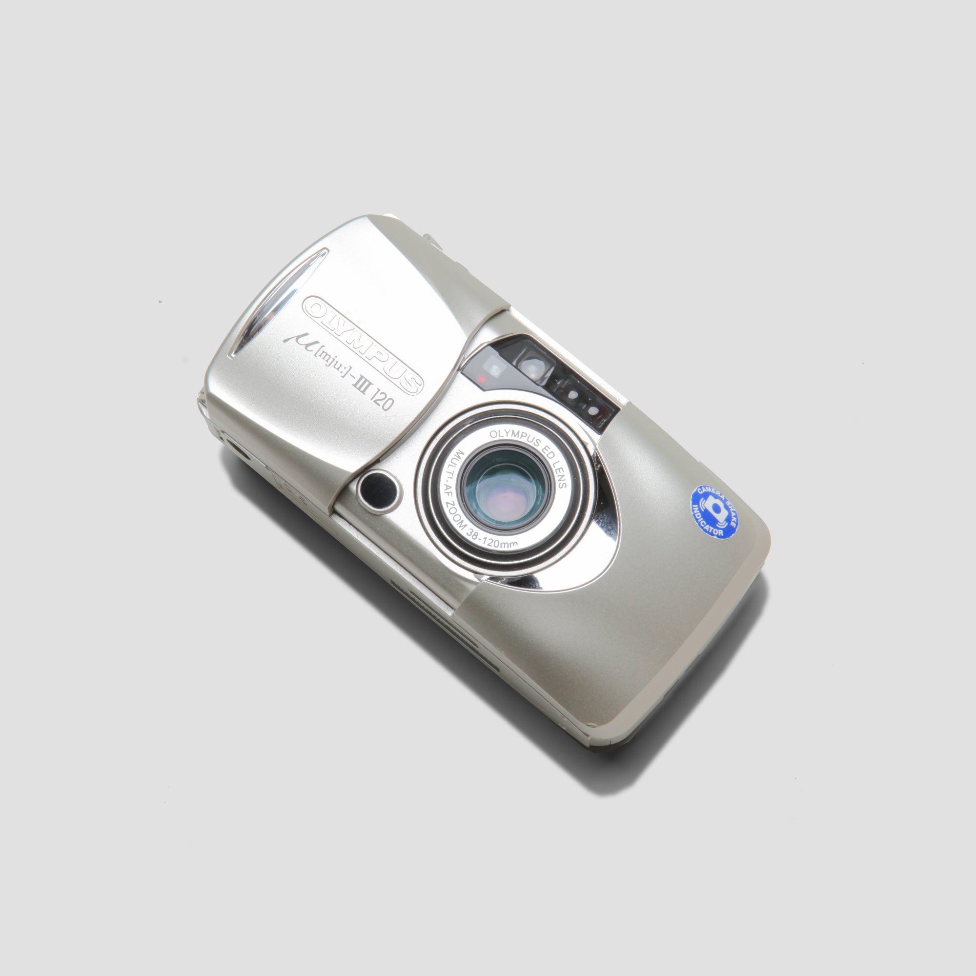 Close-up of Olympus MJU III Zoom 120 highlighting its autofocus and sleek design.