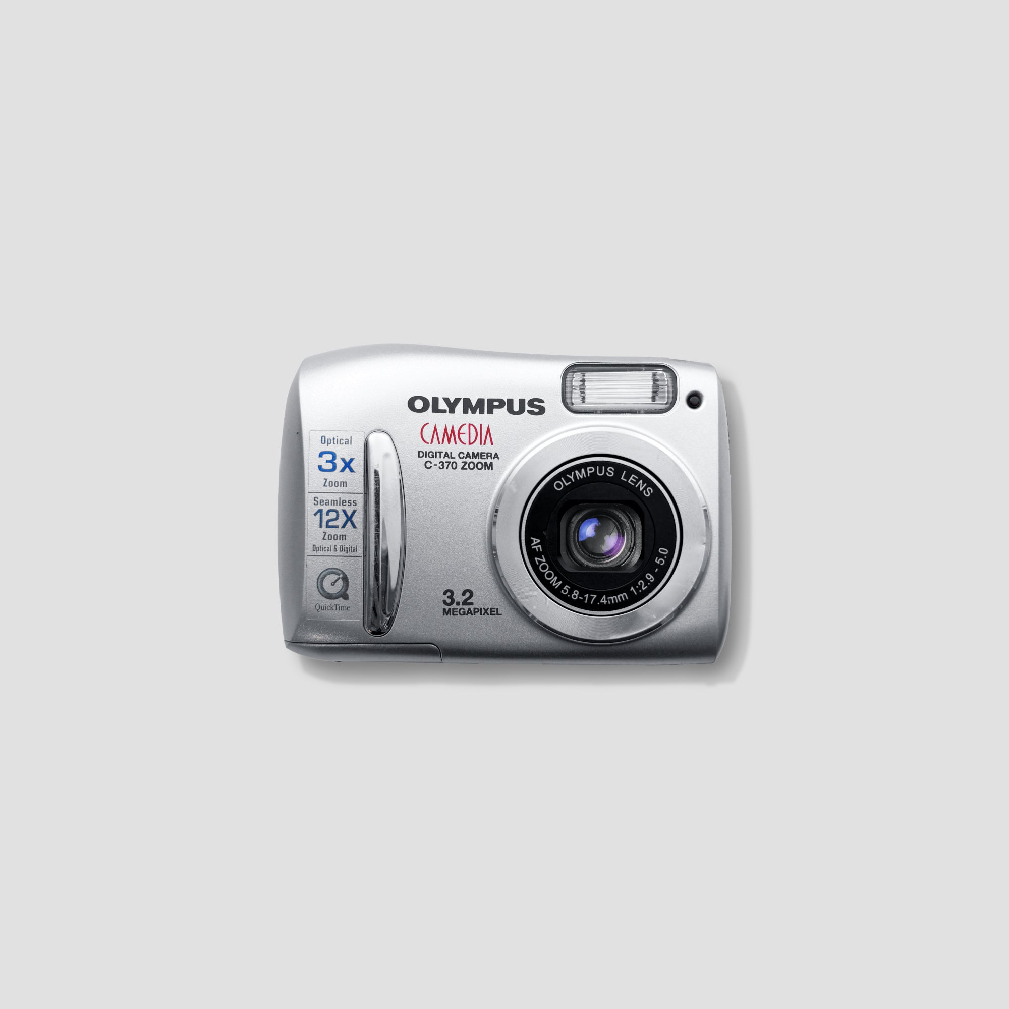 Olympus Camedia C-370 side profile showcasing its compact size and zoom lens