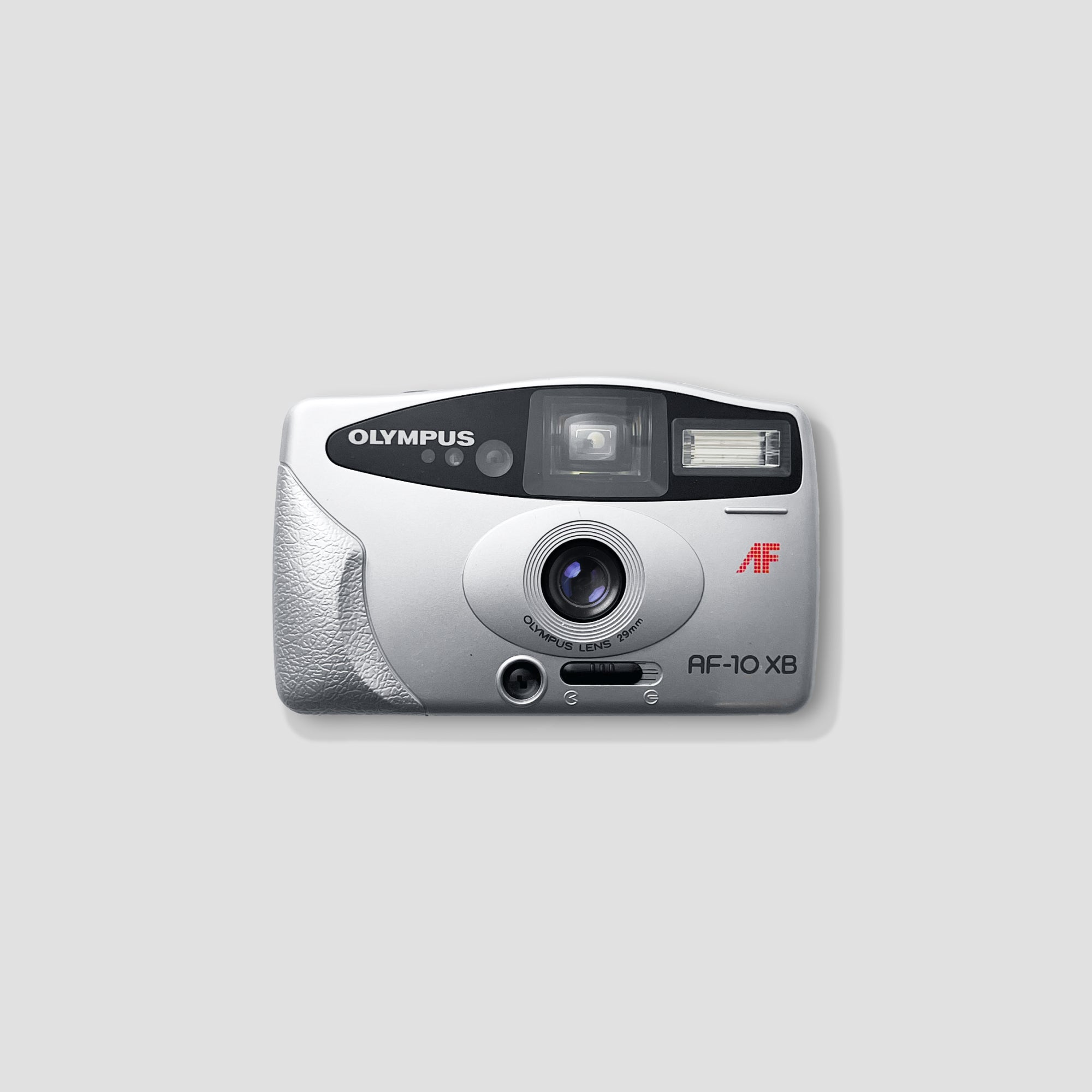 Olympus AF-10 XB camera showing the lens and viewfinder for street photography