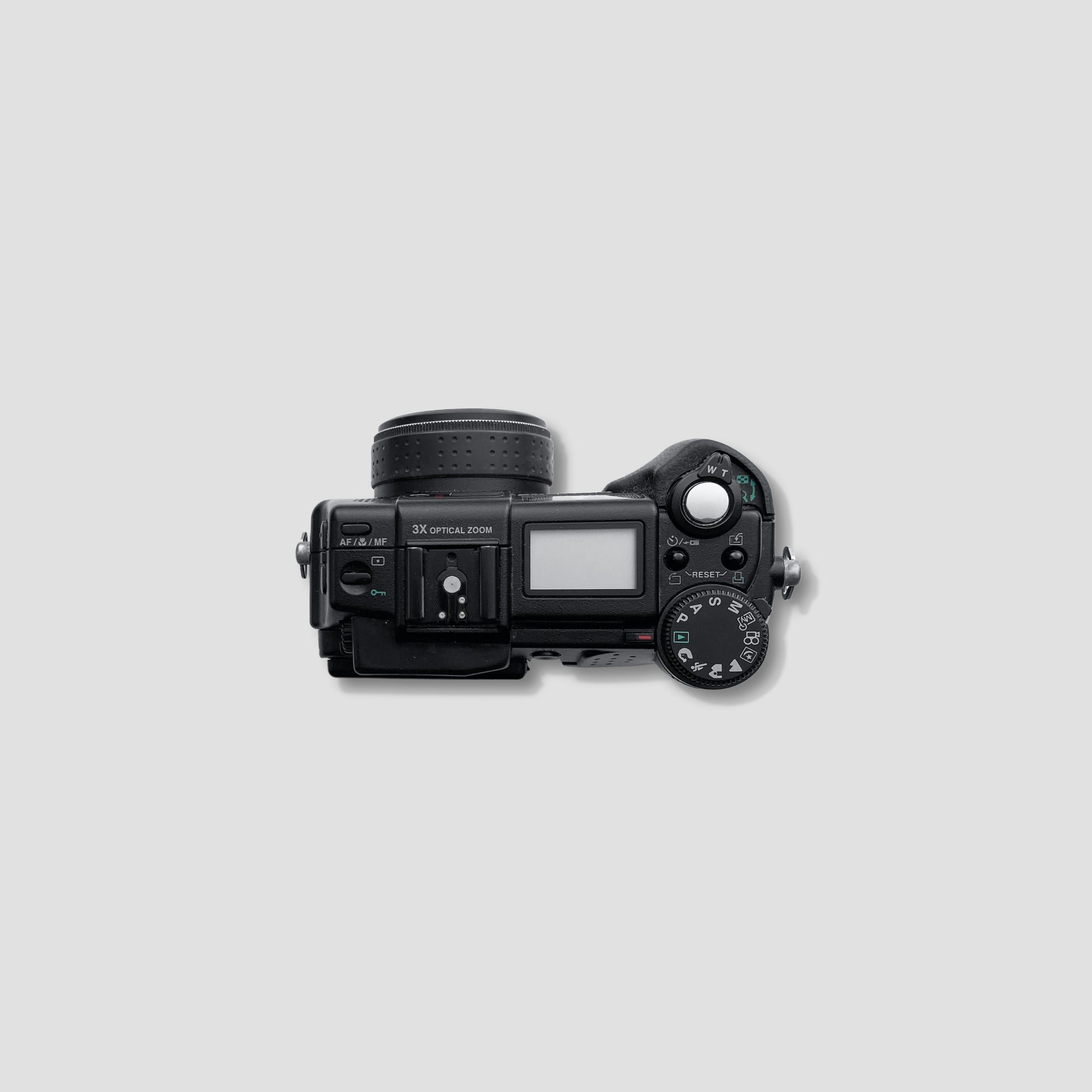 Front view of Olympus digital camera highlighting its bright lens and compact design