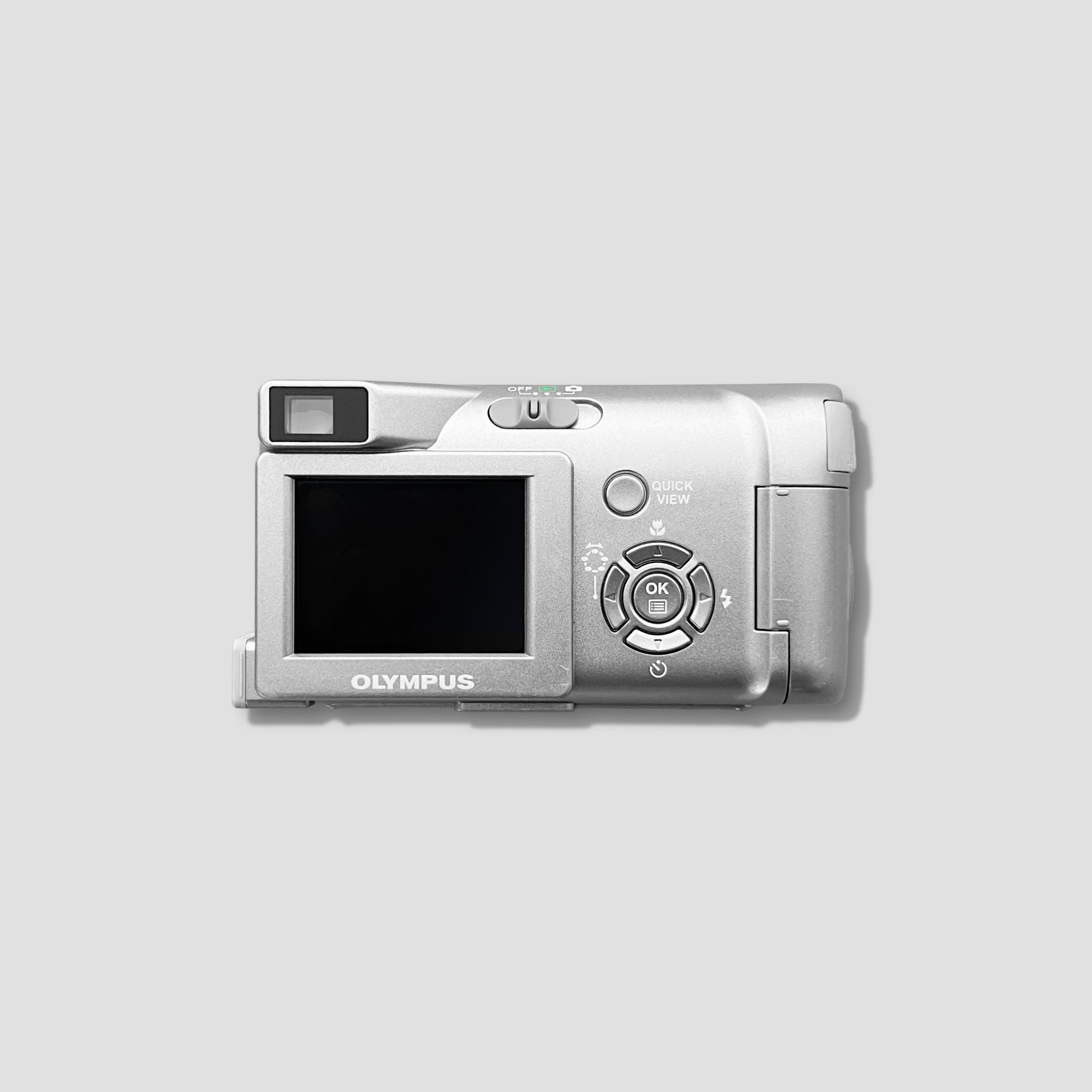 User holding Olympus C-310 for outdoor photography