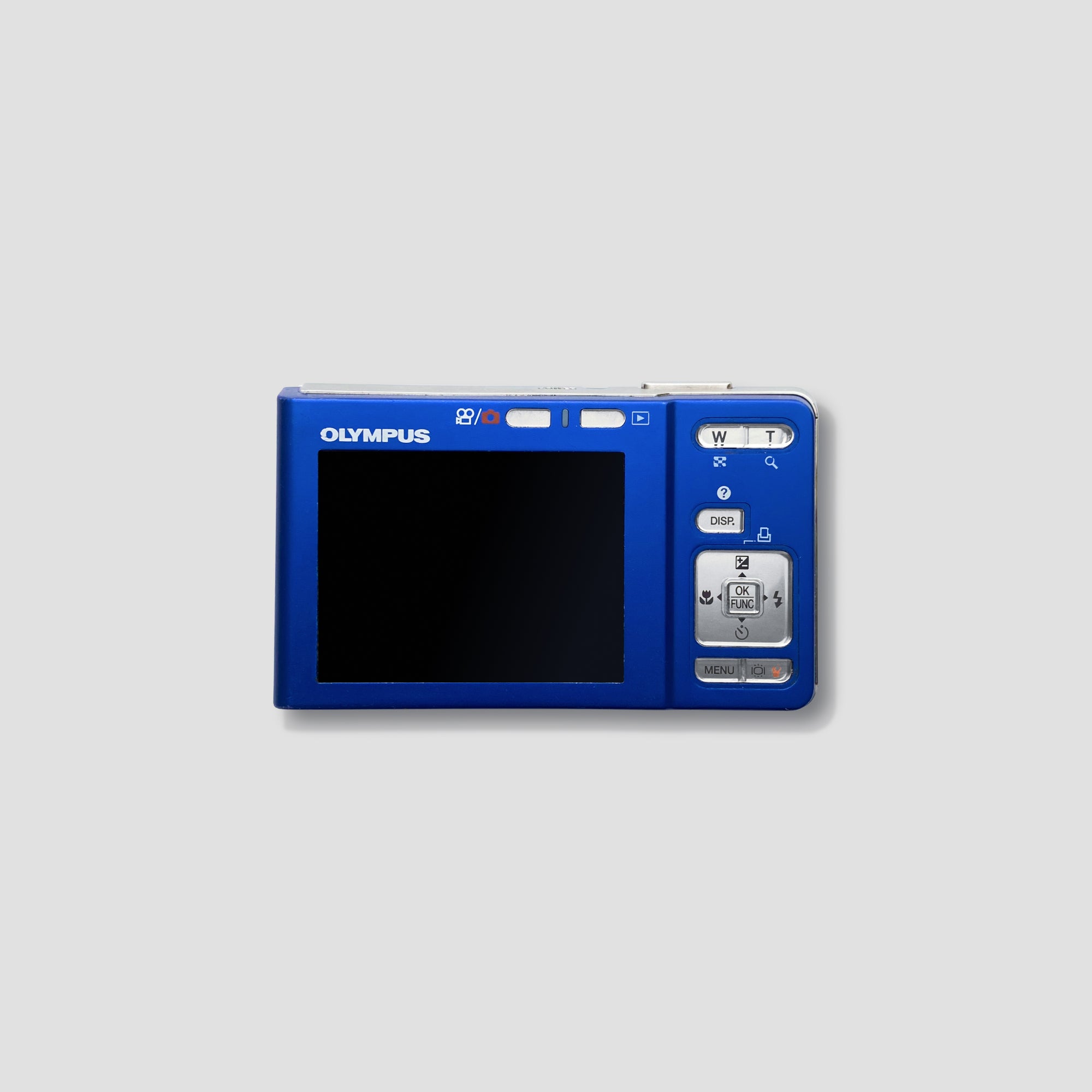 Olympus FE-360 camera in use outdoors, capturing vibrant scenes, ideal for beginner photographers.