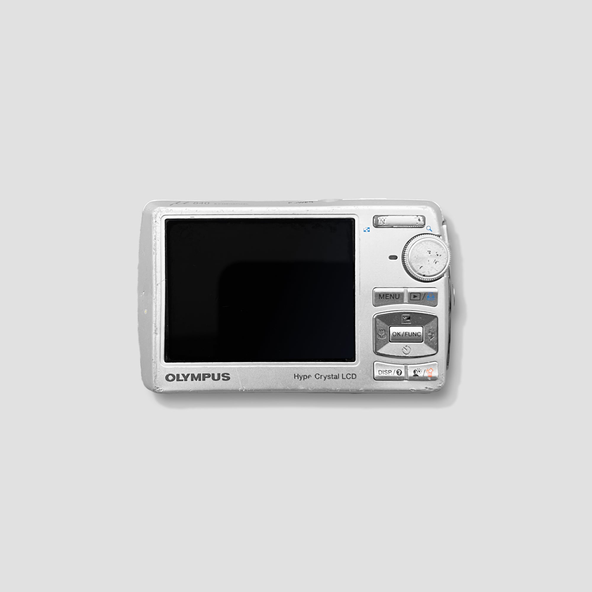 The Olympus Mju Digital 840 in use outdoors, capturing a scenic landscape
