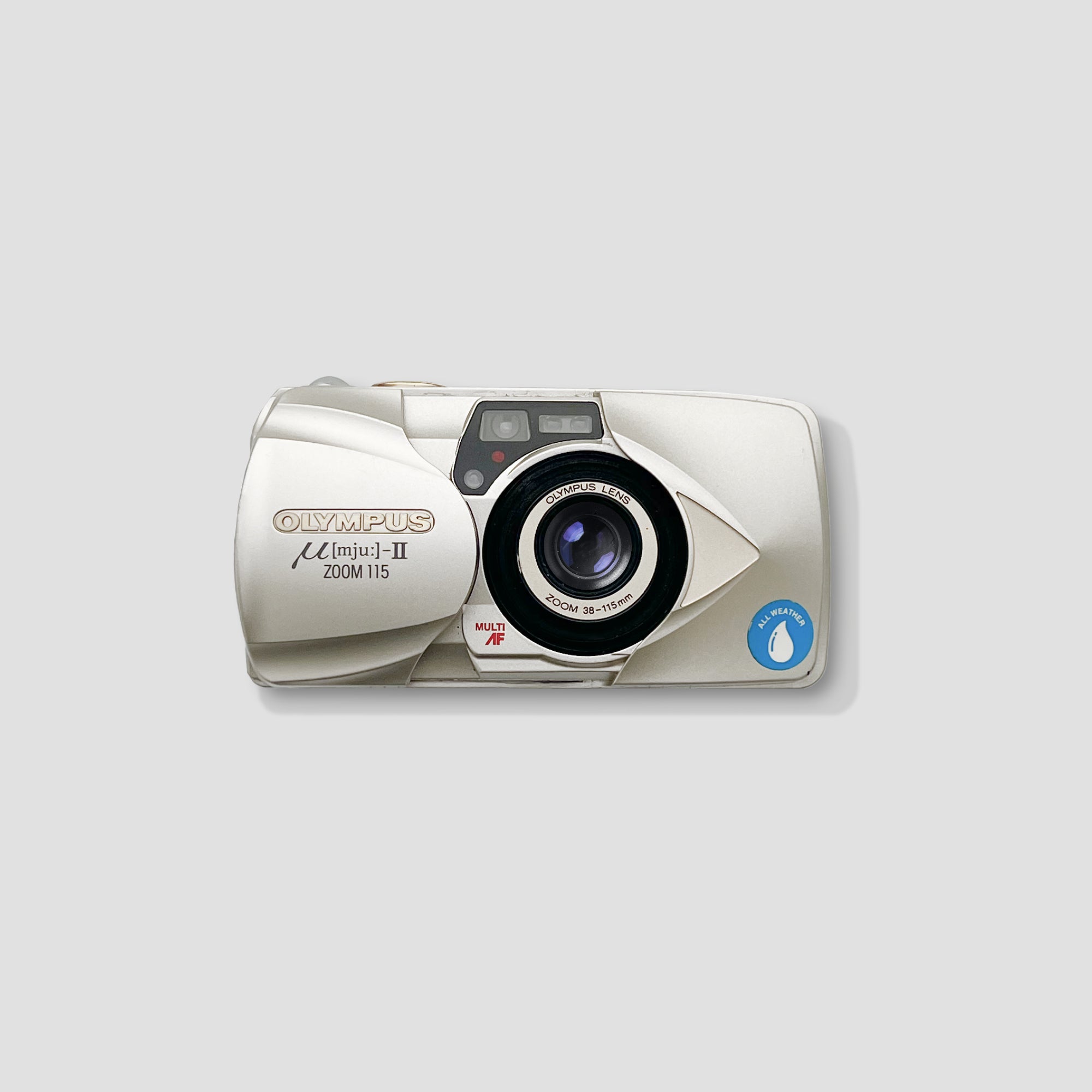 Close-up of the zoom lens on the Olympus MJU II, ideal for landscape and portrait photography