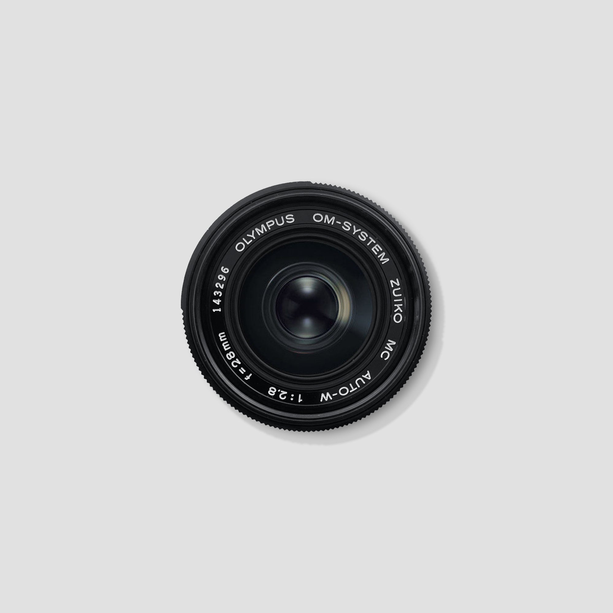 Olympus Zuiko 28mm f/2.8 lens showcasing its compact design and multi-coated optics