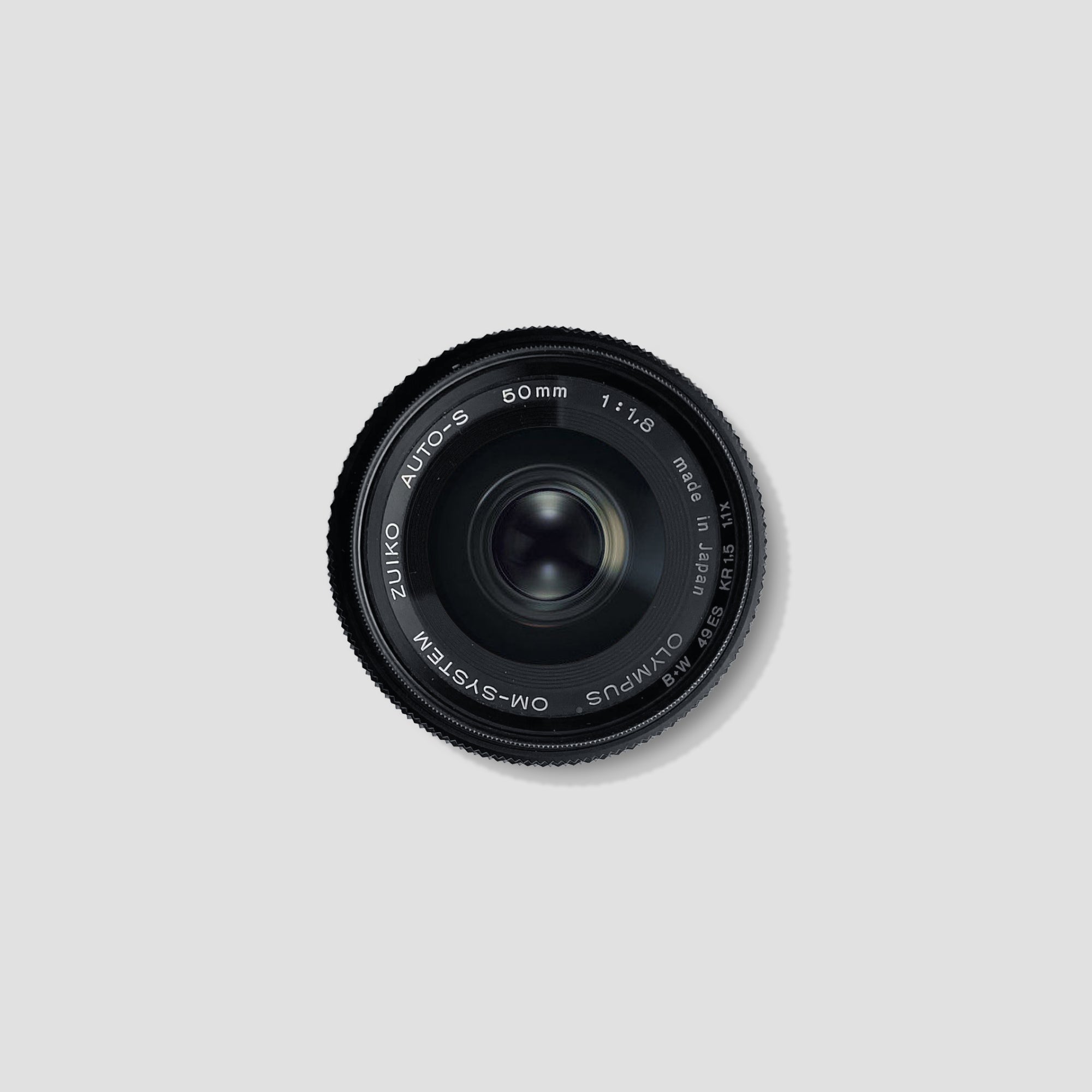 Close-up of Olympus OM-System 50mm f/1.8 lens with focus on aperture blades