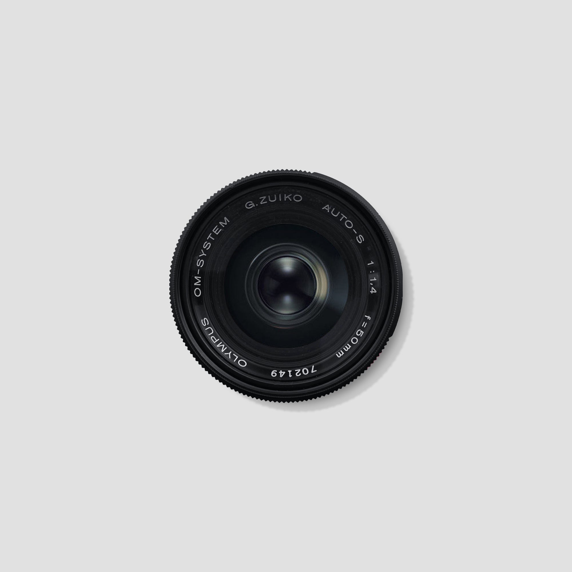 Olympus Zuiko 50mm f/1.4 lens front view highlighting the aperture ring