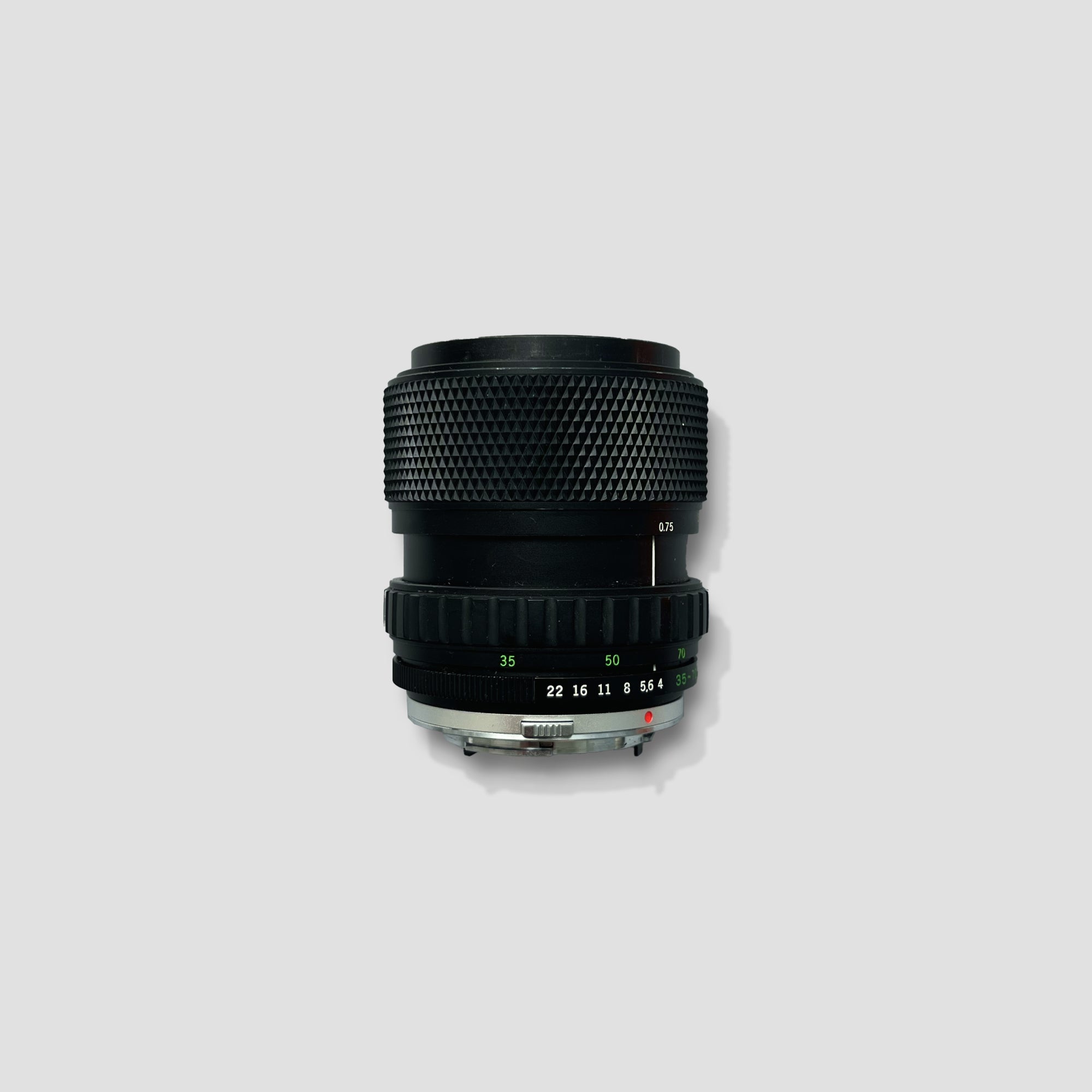 Photographer using the Olympus 35-70mm lens to capture stunning outdoor landscapes.
