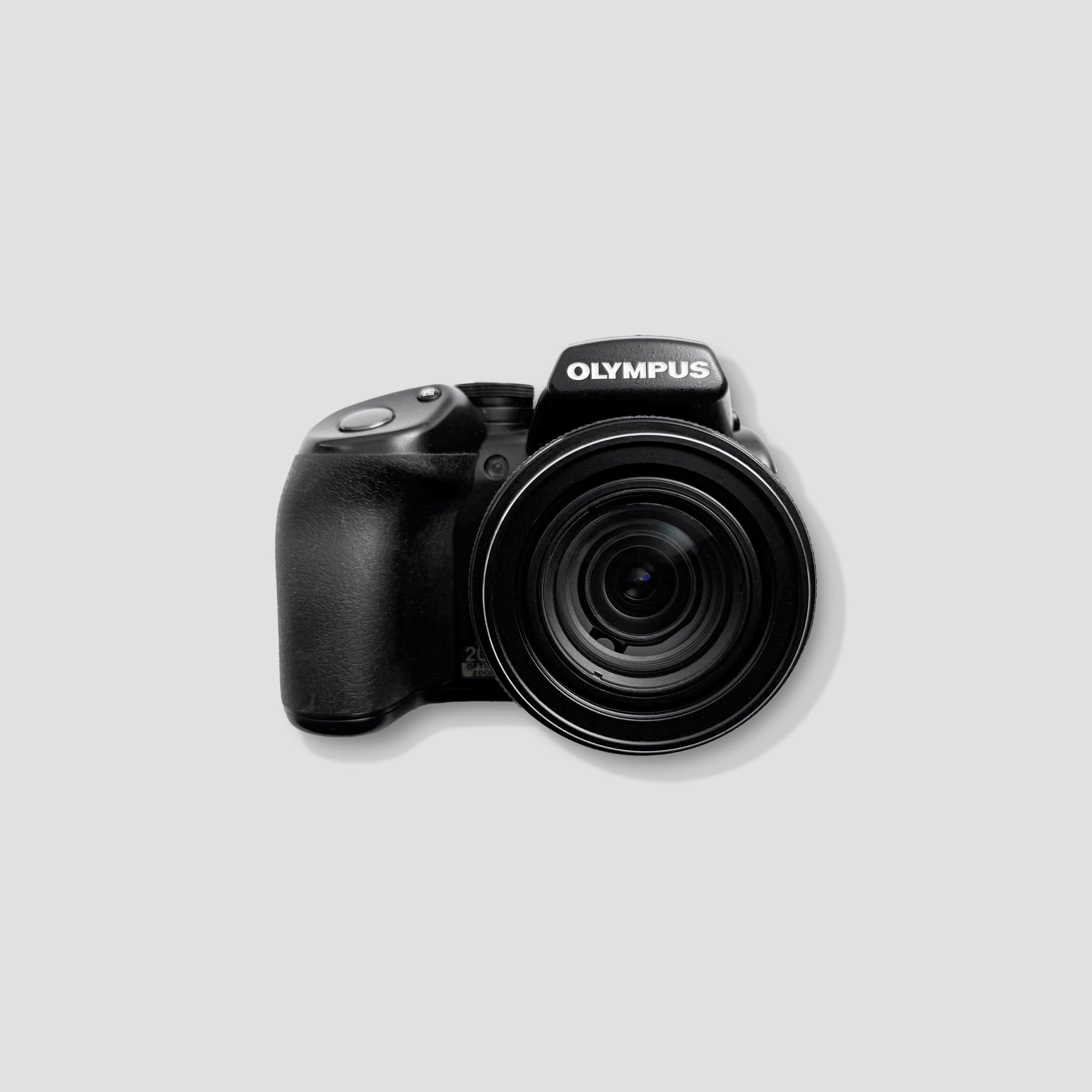 Olympus SP-570UZ bridge camera showing ergonomic design and grip.