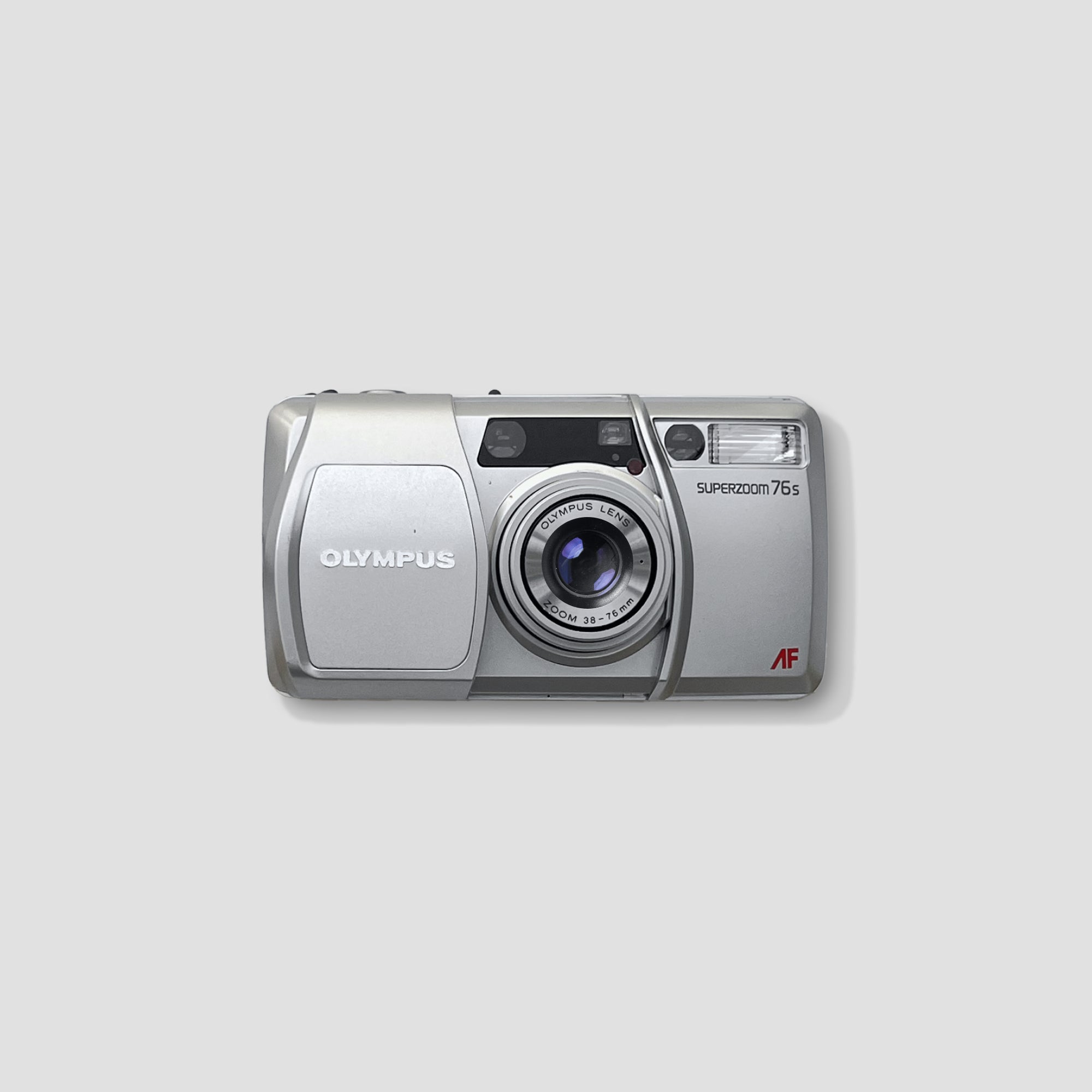 Olympus Superzoom 76s in action at a family gathering, capturing warm memories with its automatic features.