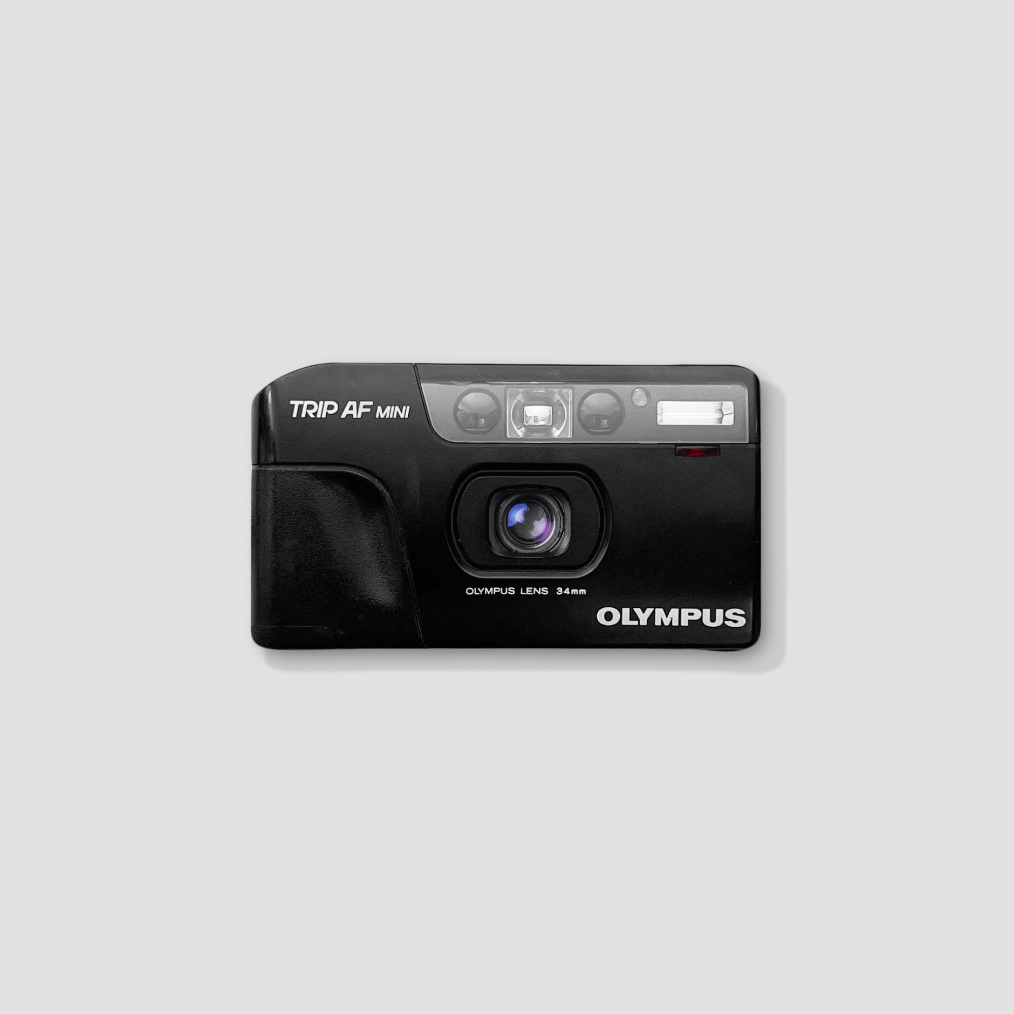 Olympus Trip AF Mini camera showing front view for travel photography
