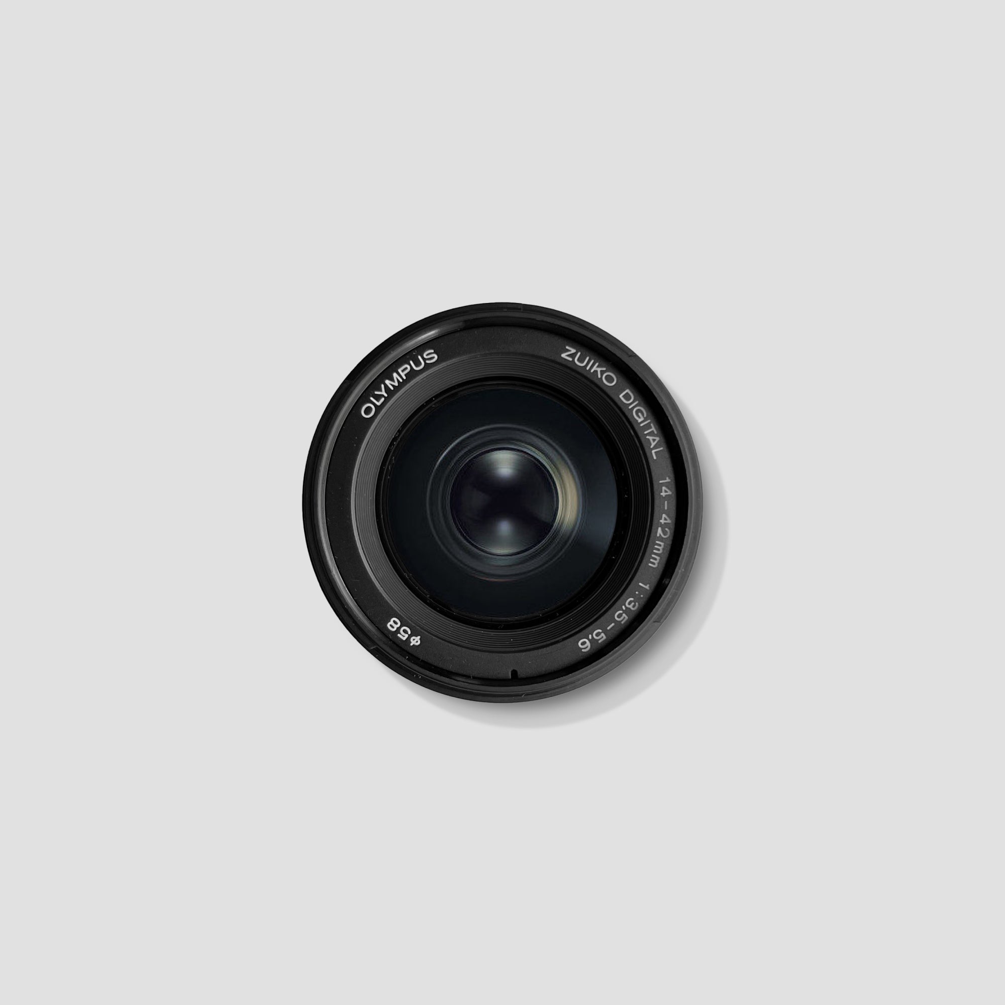 Close-up of the Olympus 14-42mm zoom lens highlighting its build quality.