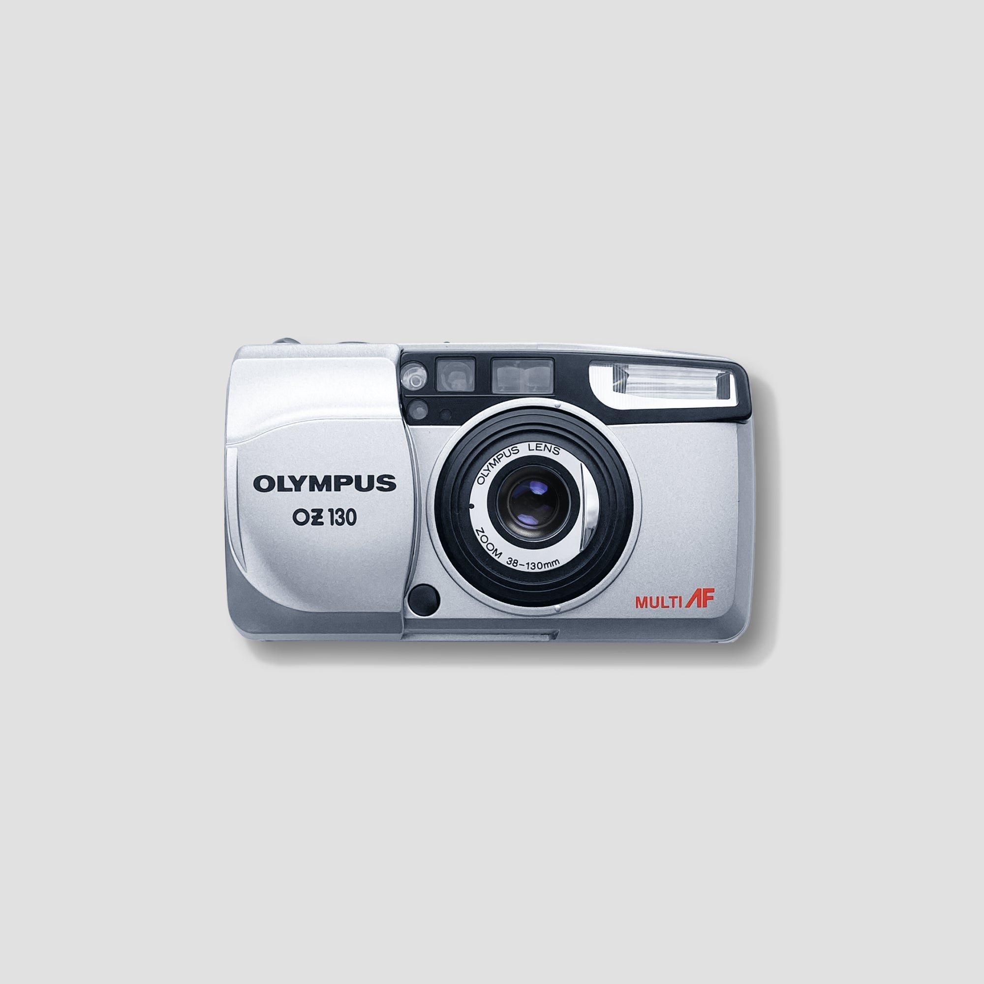 Close-up of the Olympus OZ 130 35mm film camera displaying its zoom lens and sleek design.