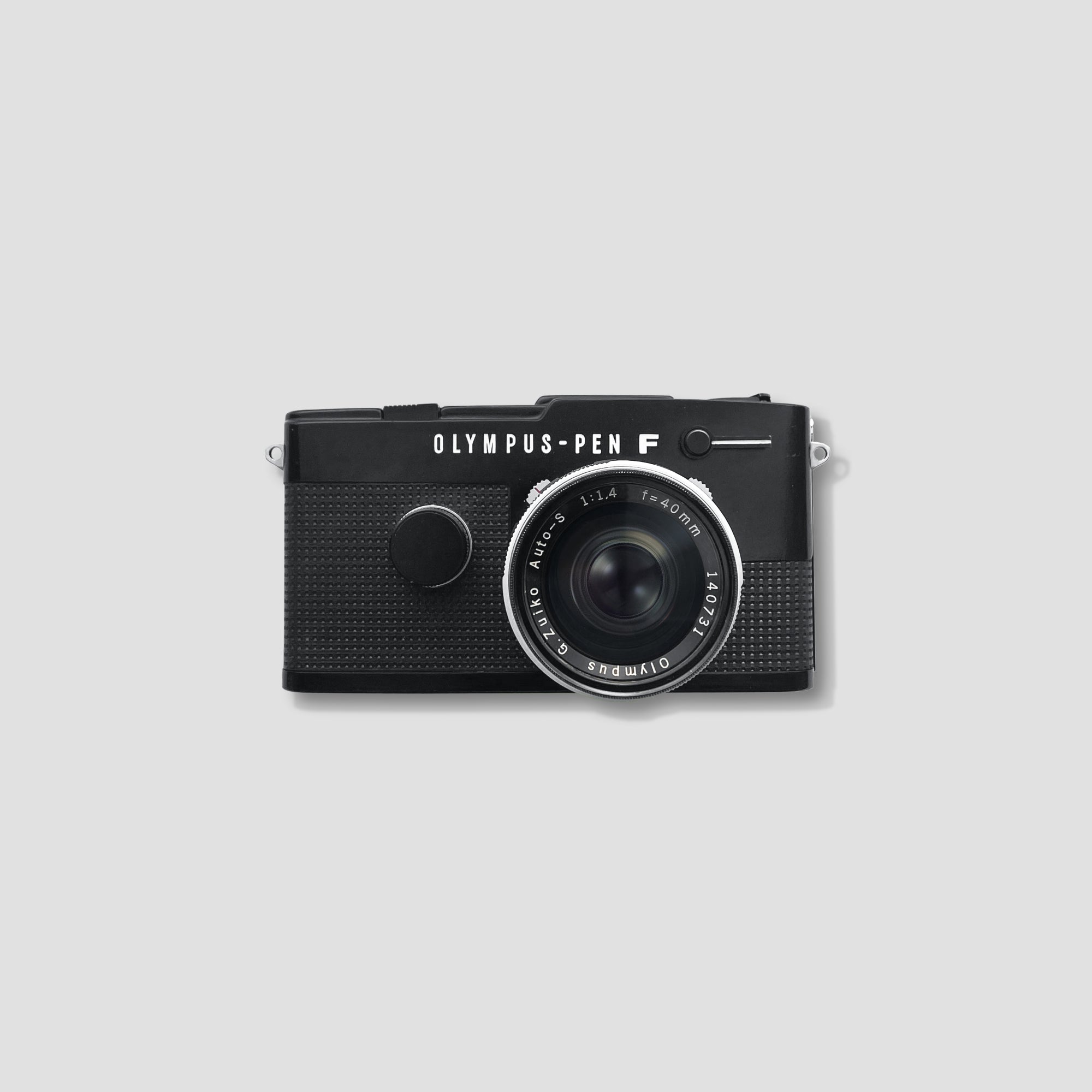 Close-up of Olympus Pen FT camera showing its minimalist design and controls