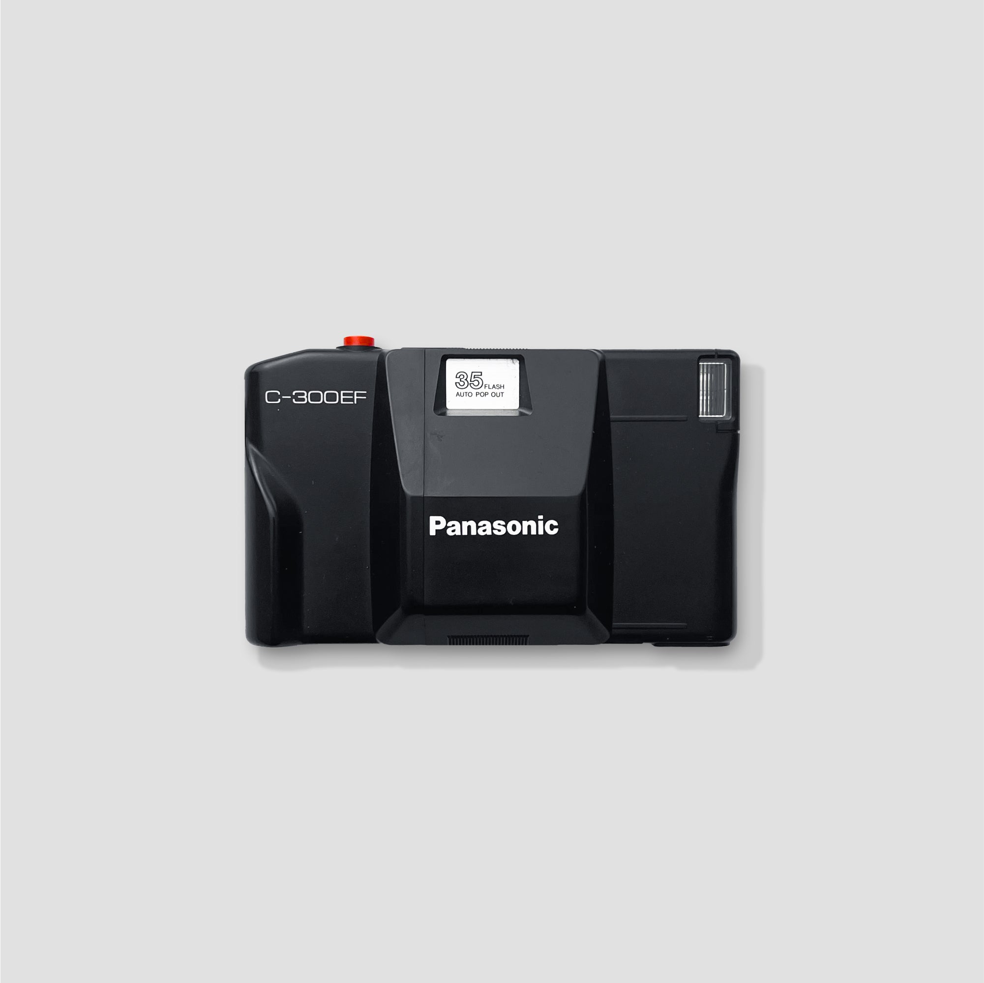 User  capturing photos with the Panasonic C-300EF at a vibrant outdoor event.
