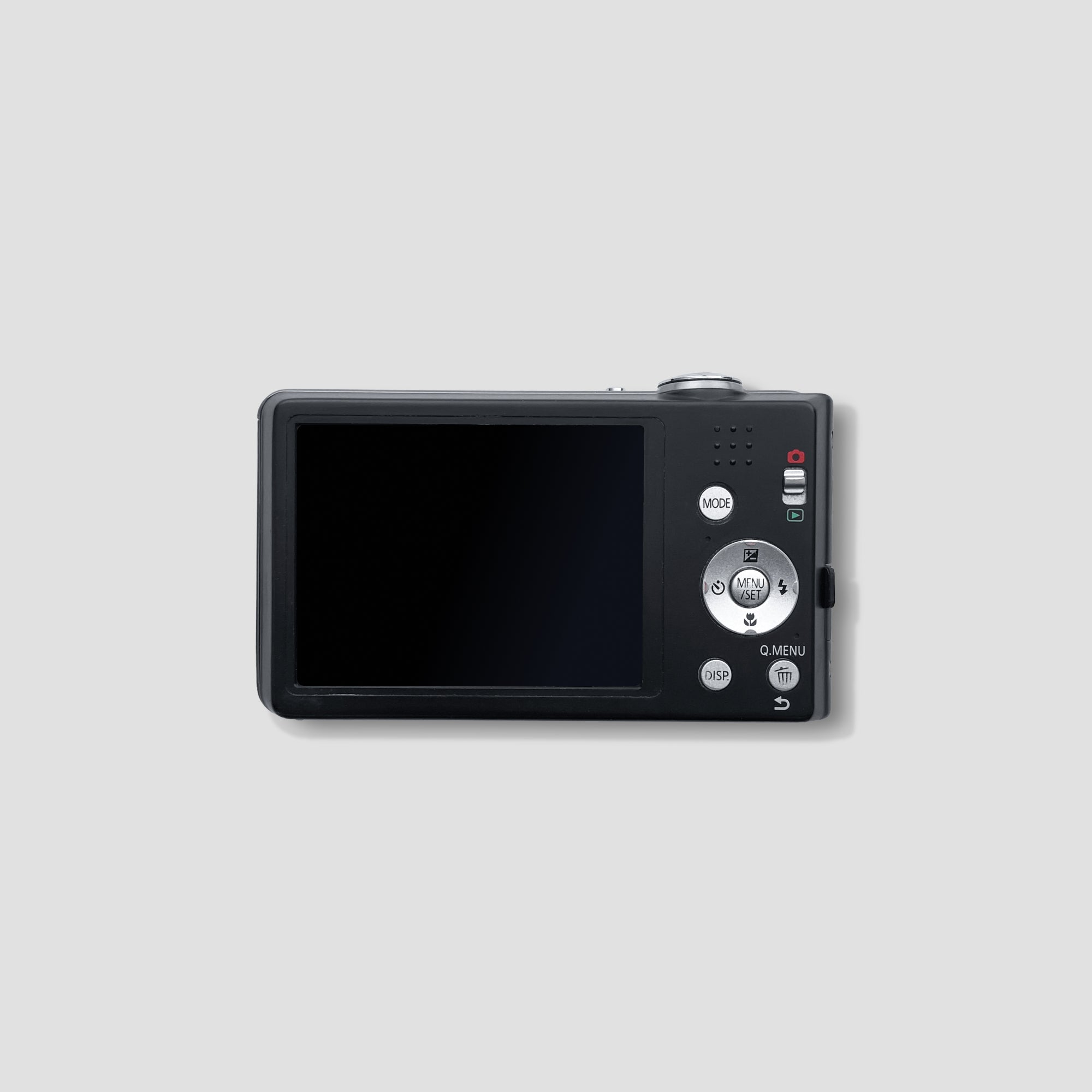 User  holding the Panasonic Lumix DMC-FS16 while traveling in a scenic location
