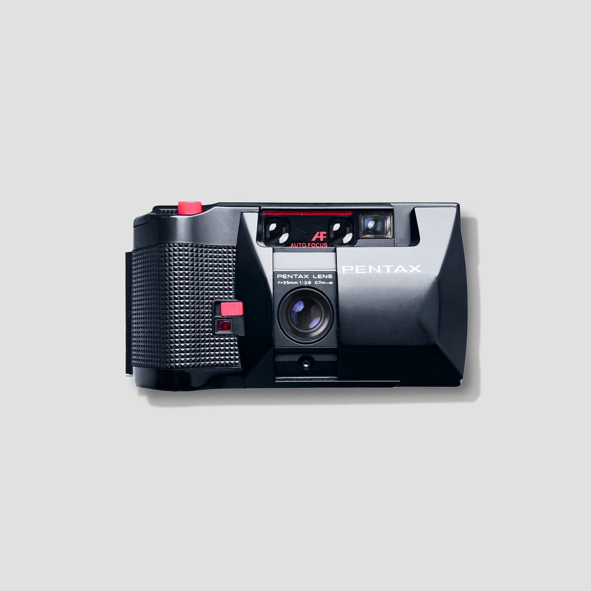 Close-up of the Pentax PC35AF-M showing the autofocus lens and compact body