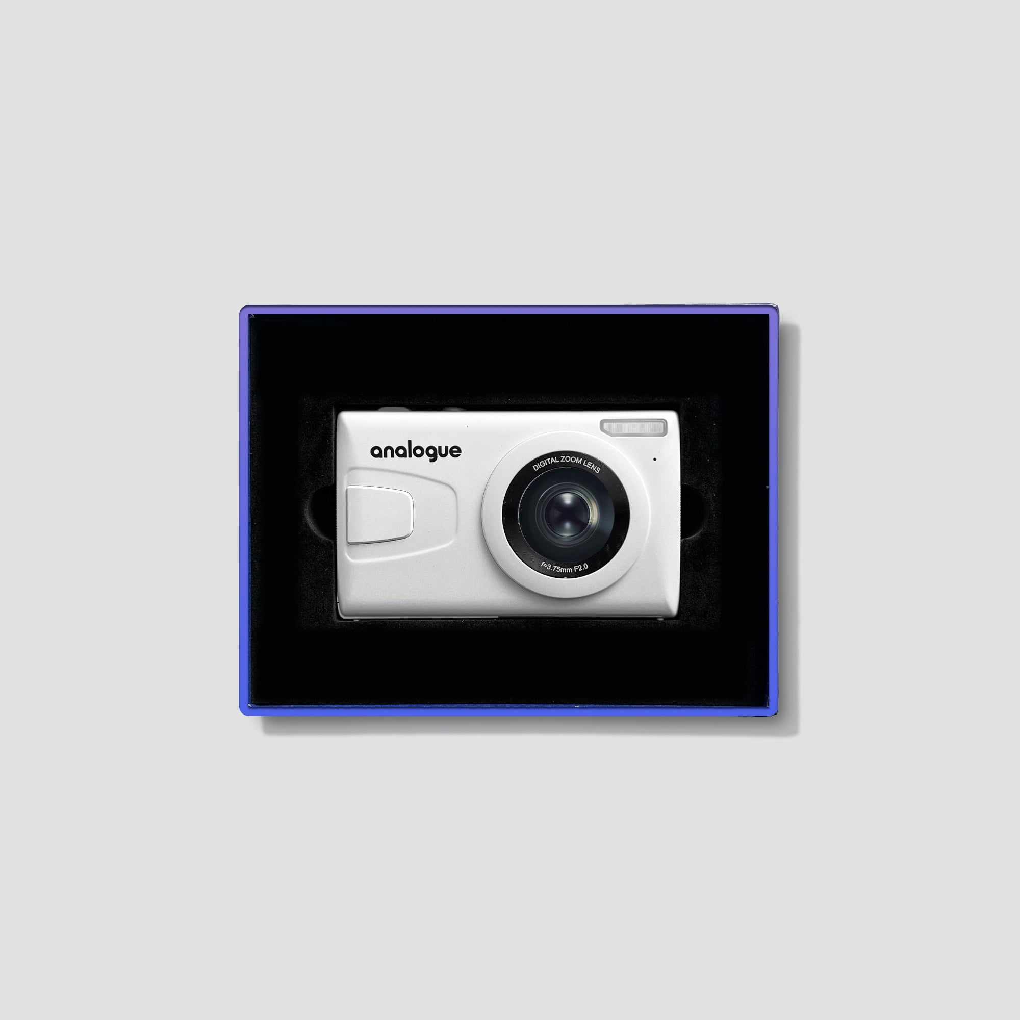 Front view of the compact digital camera showing its small size and sleek design