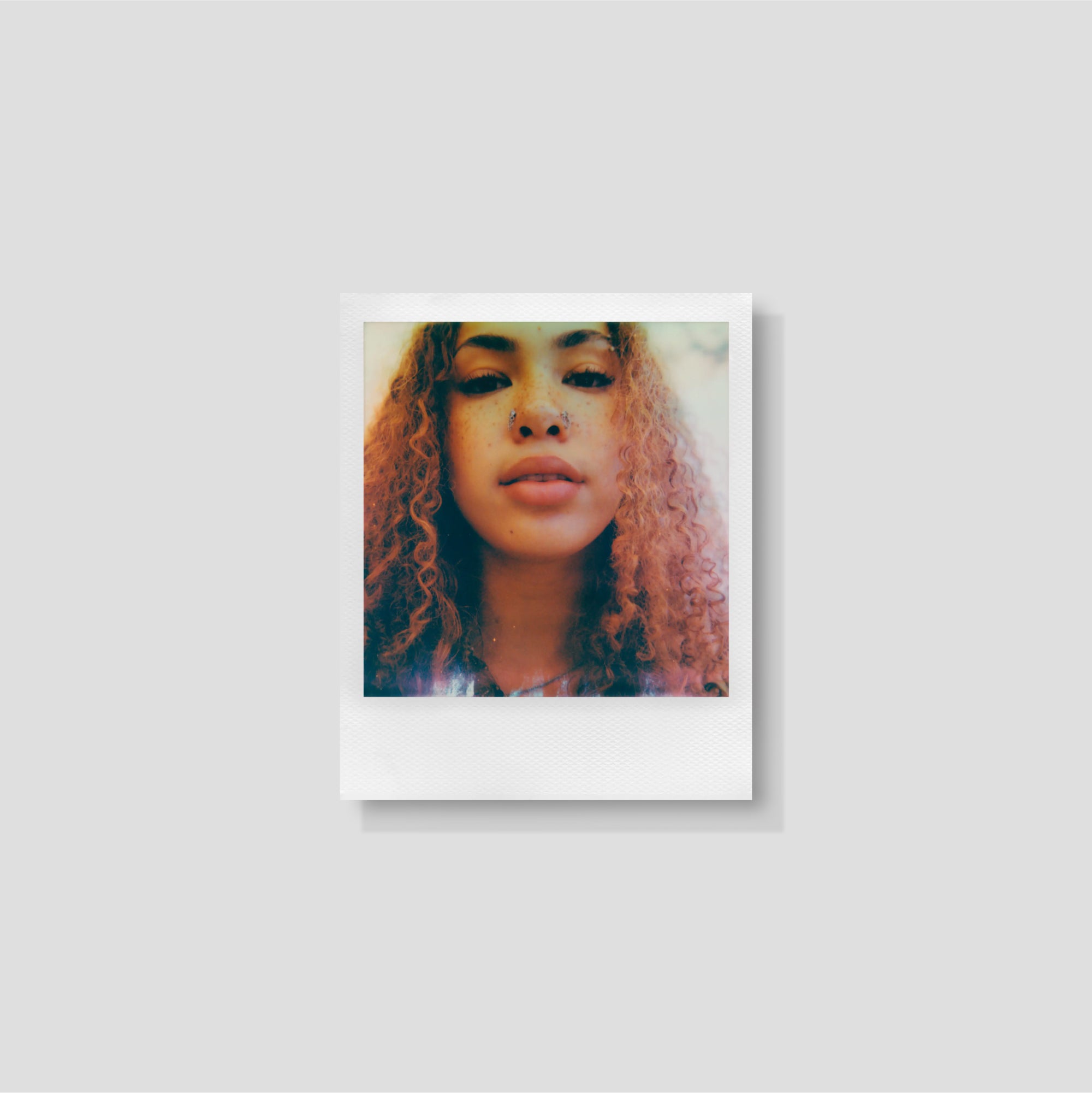 A Polaroid 600 camera loaded with instant film ready to shoot