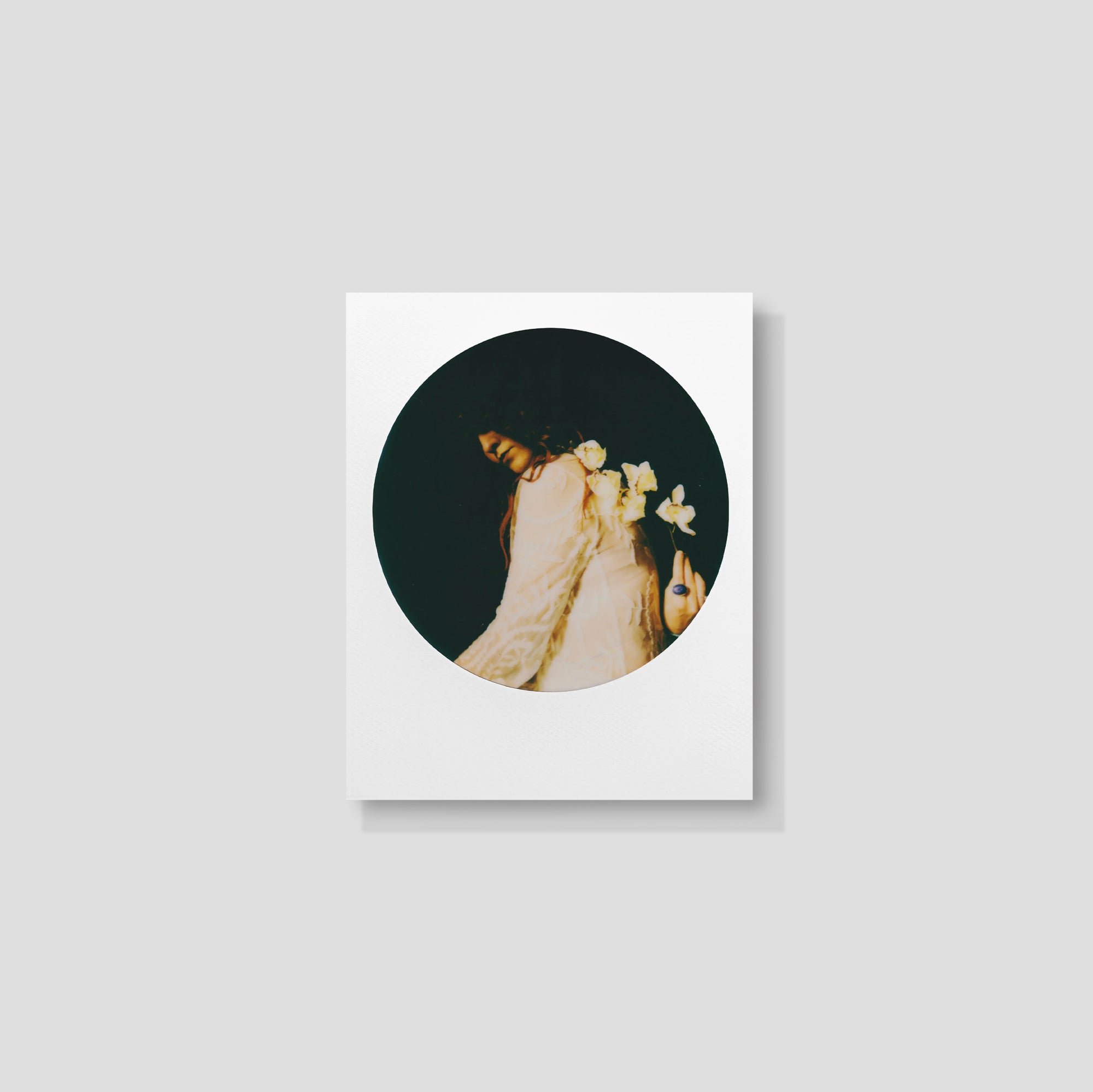Sample instant photo with a round frame, vibrant colors, captured with Polaroid film