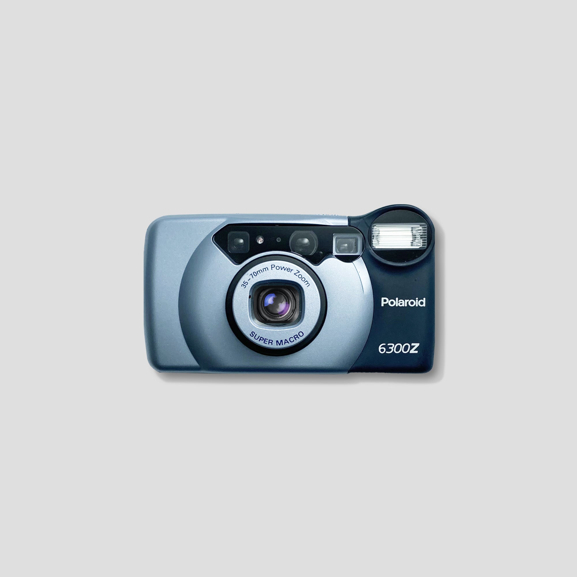 Polaroid 6300Z film camera with zoom lens in action outdoors
