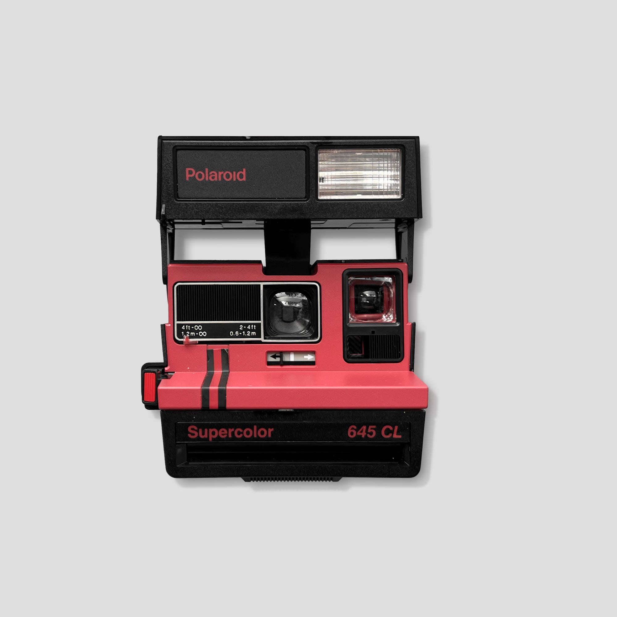 Close-up of Polaroid Supercolor 645 CL vintage instant film camera showing its colorful retro design