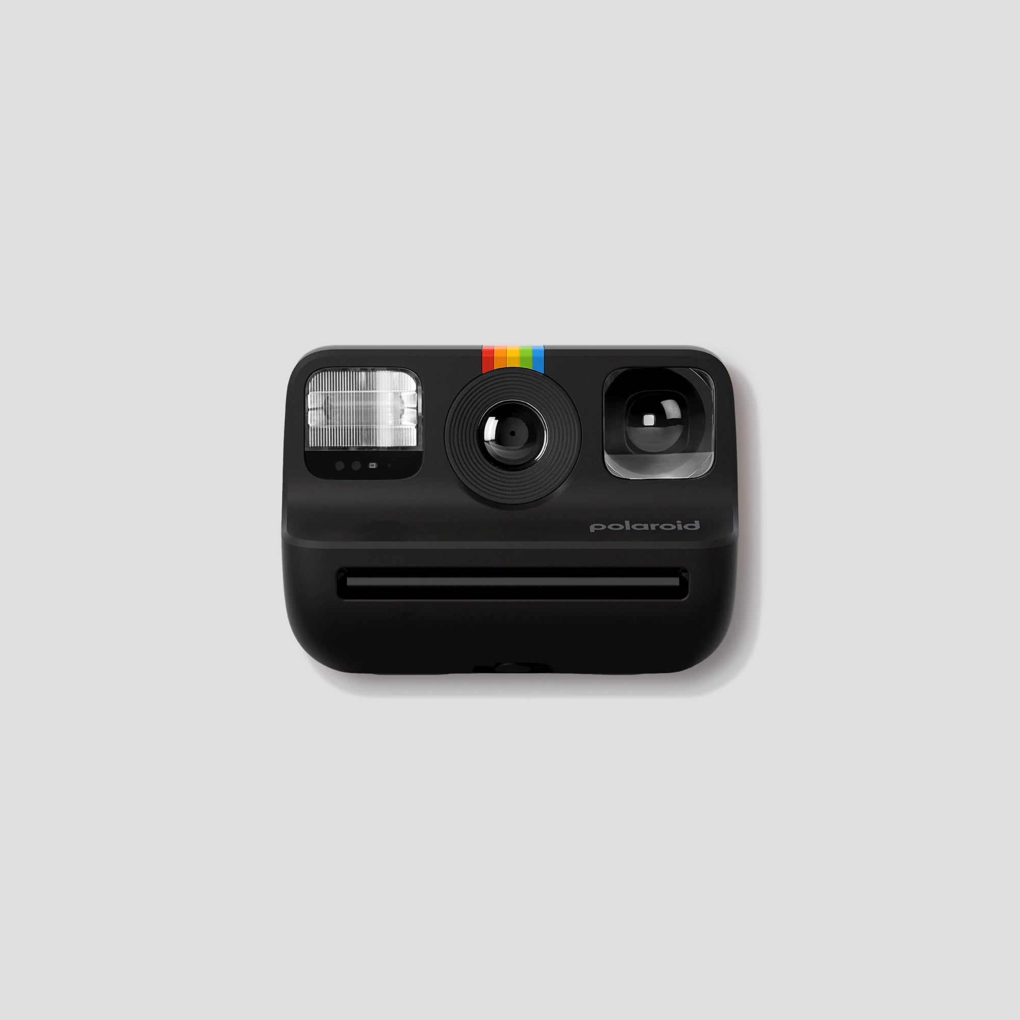 Polaroid Go 2 Instant Camera with selfie mirror feature in an outdoor setting.
