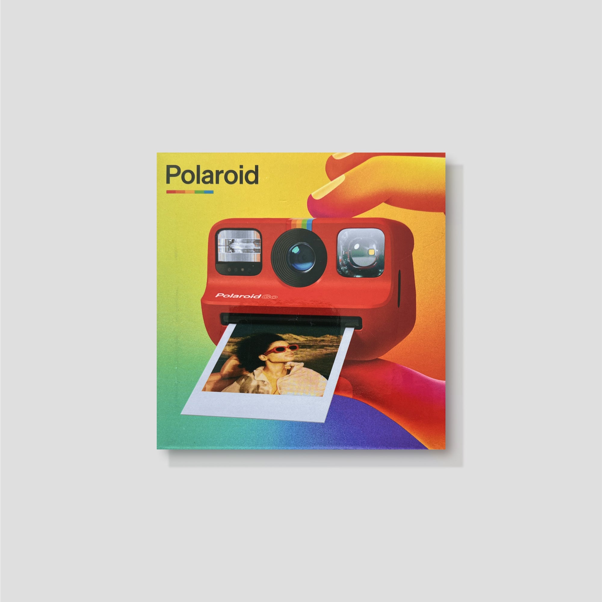 Compact instant camera in classic design, perfect for capturing memories with friends.