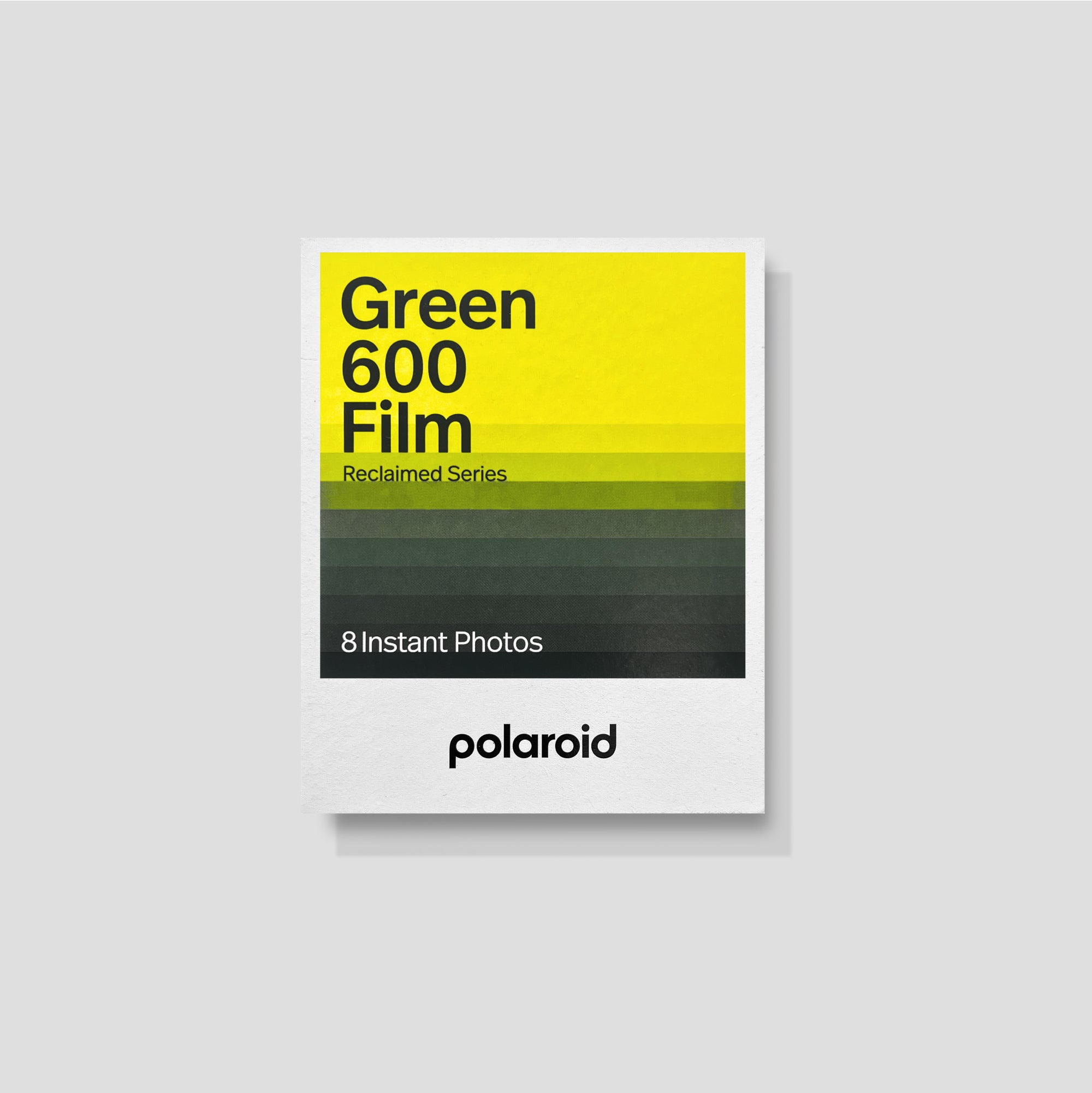 Polaroid Green 600 film pack showcased against a vibrant backdrop, highlighting its unique design and branding.