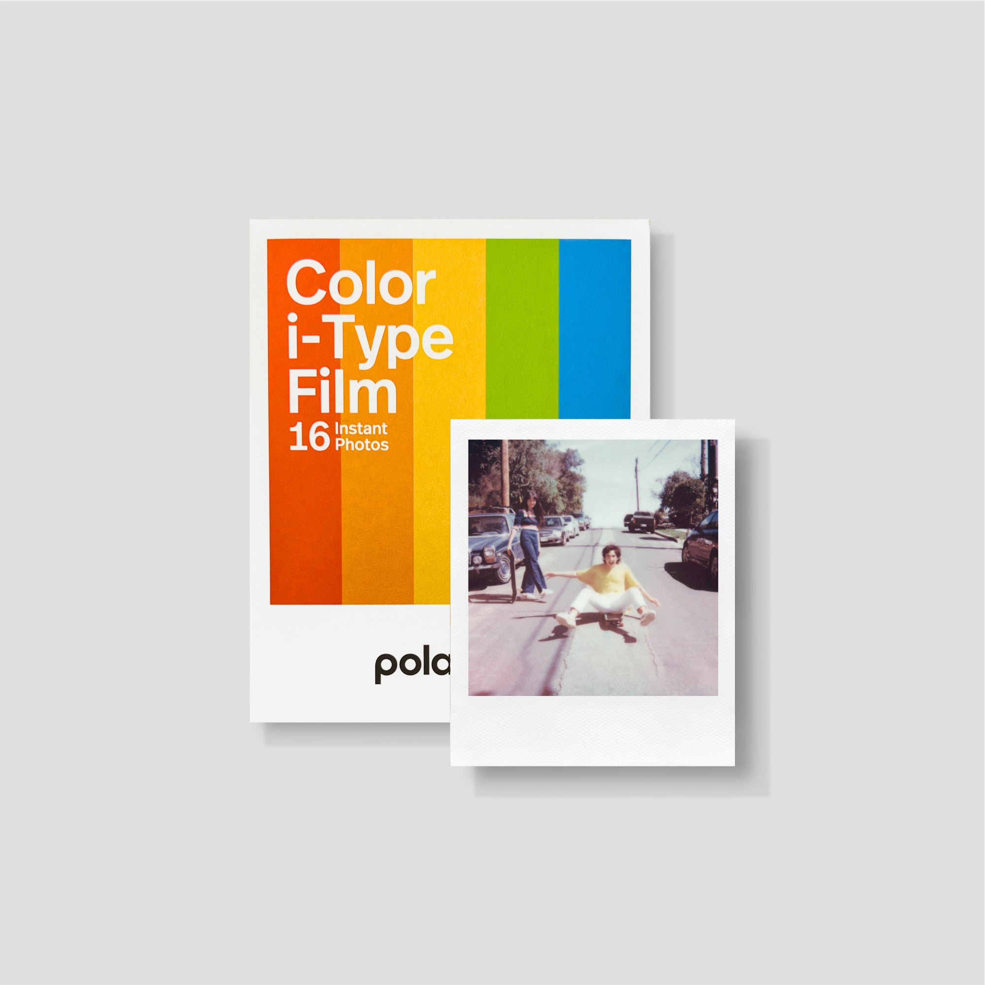 Polaroid Now Gen 2 instant camera on a wooden surface, showcasing its classic look and autofocus lens