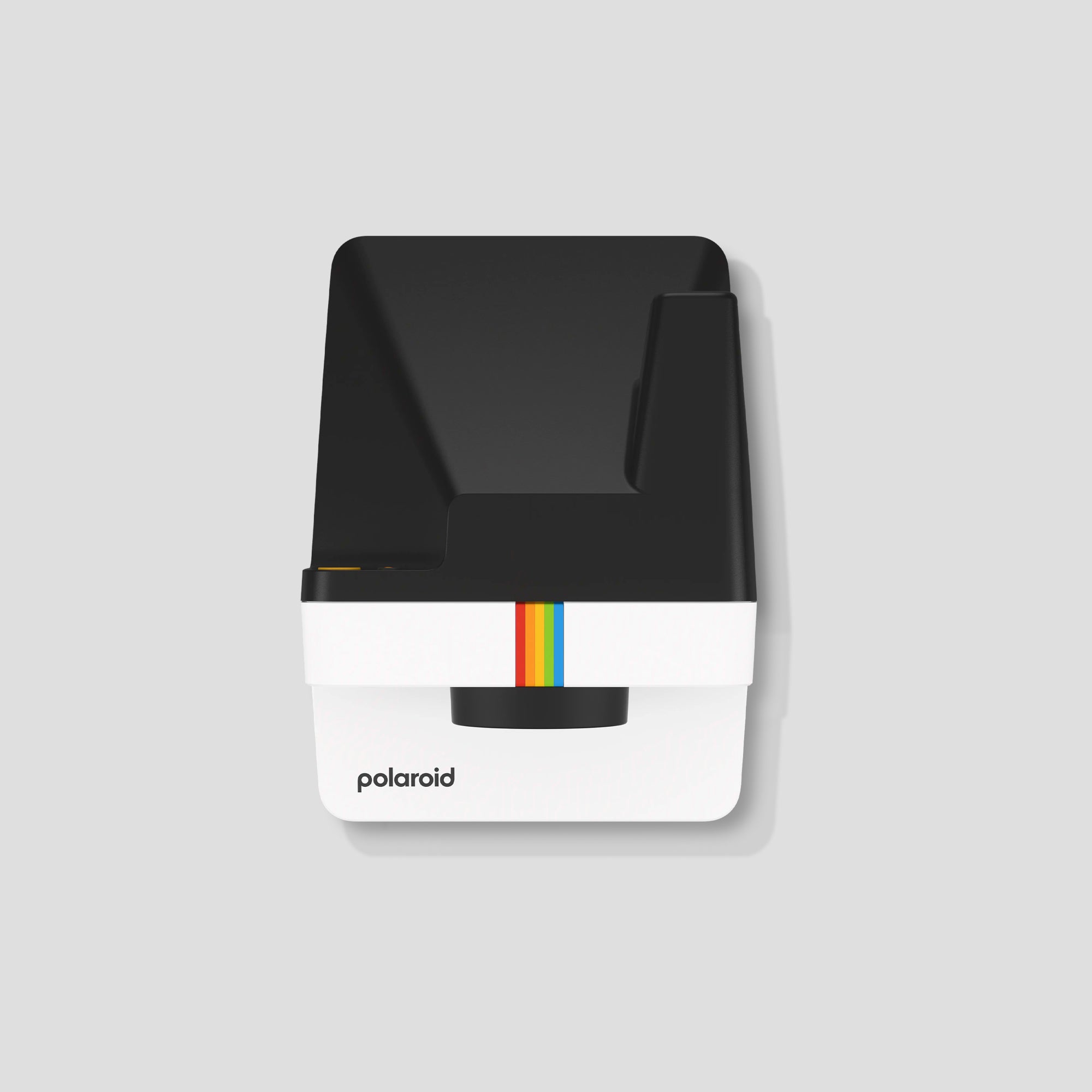Close-up of the Polaroid film output from the camera, illustrating the instant photo development process