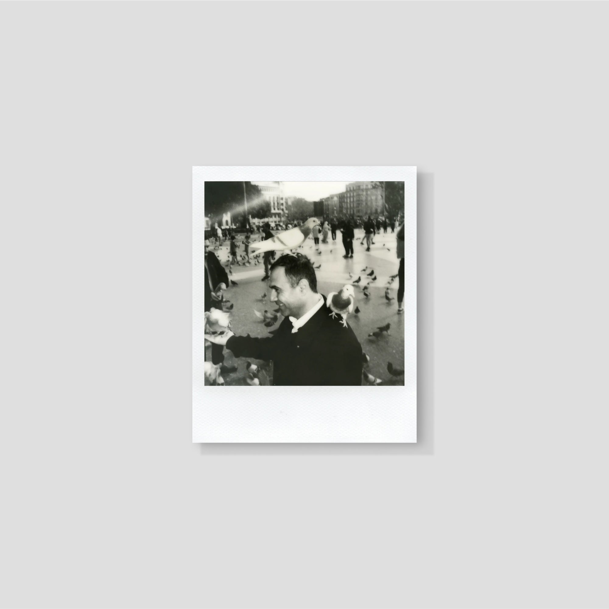 User loading i-Type film cartridge into Polaroid Now camera for easy operation