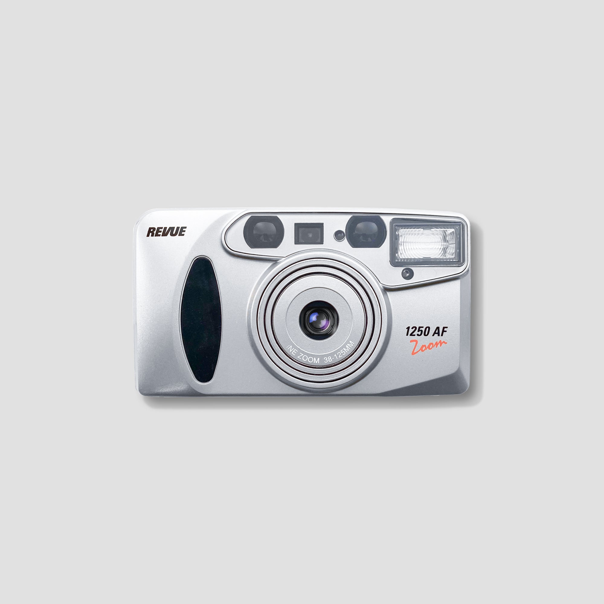 Front view of Revue 1250 AF Zoom 35mm film camera showing zoom lens and built-in flash
