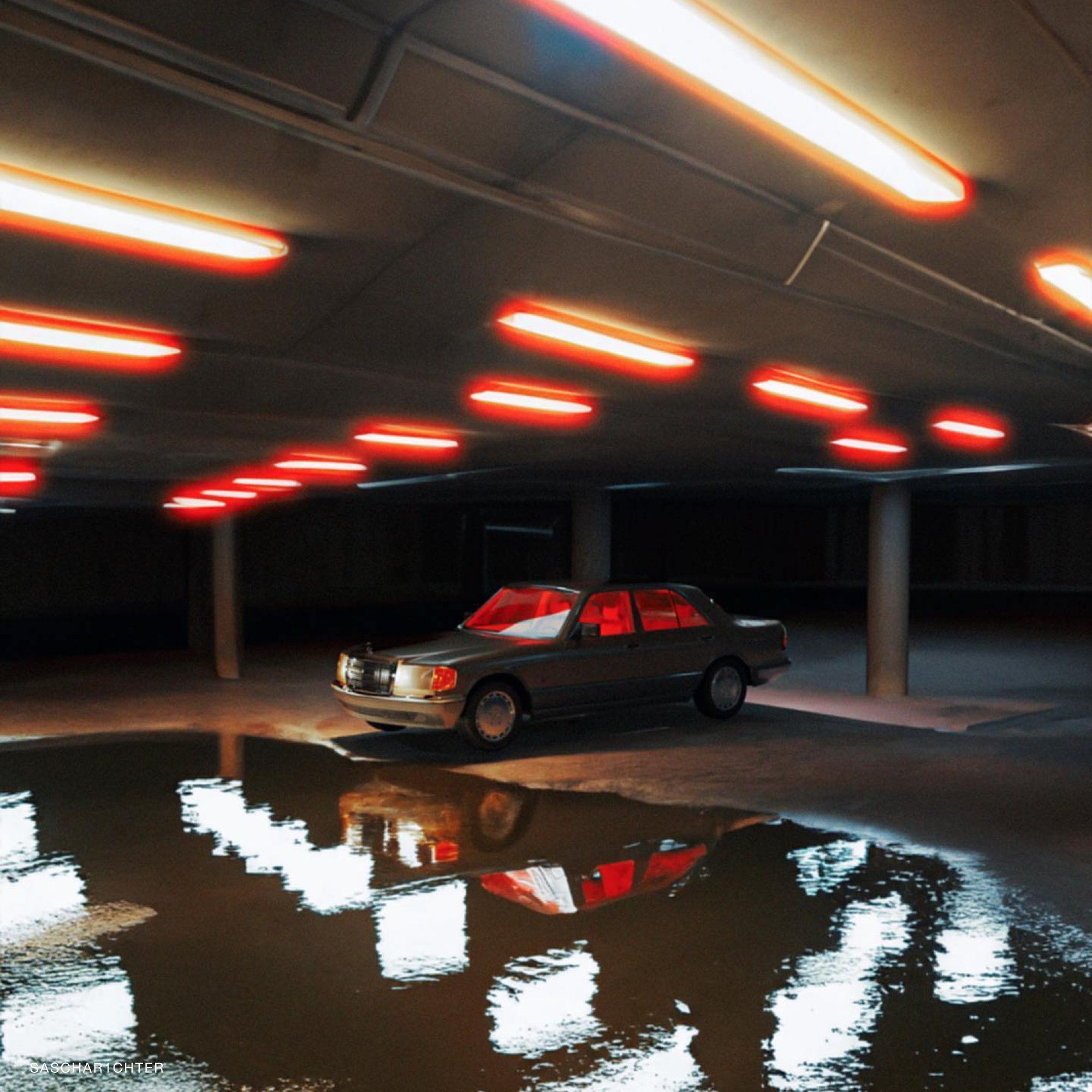 Photographer using Reflx Lab 800T in a dimly lit setting, capturing vibrant night scenes.