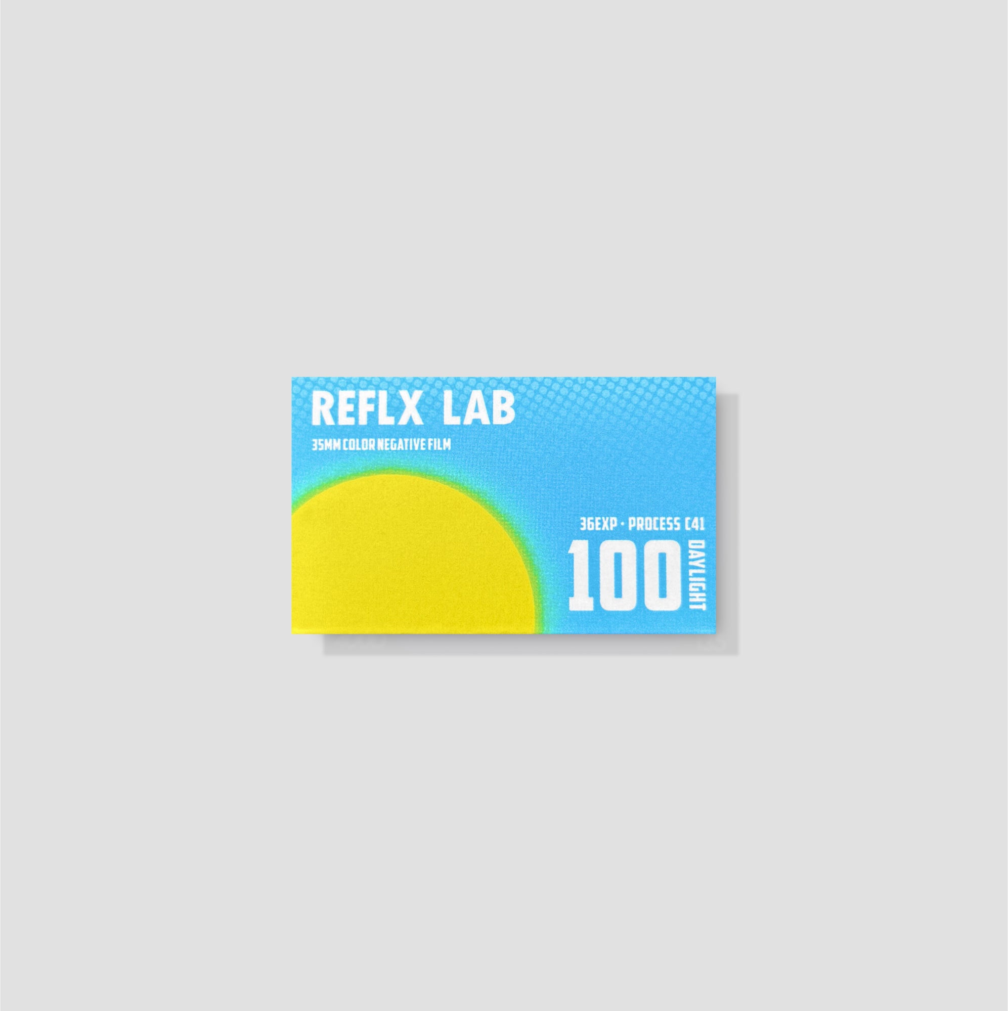 Close-up of Reflx Lab 100D 35mm slide film roll showing vibrant packaging