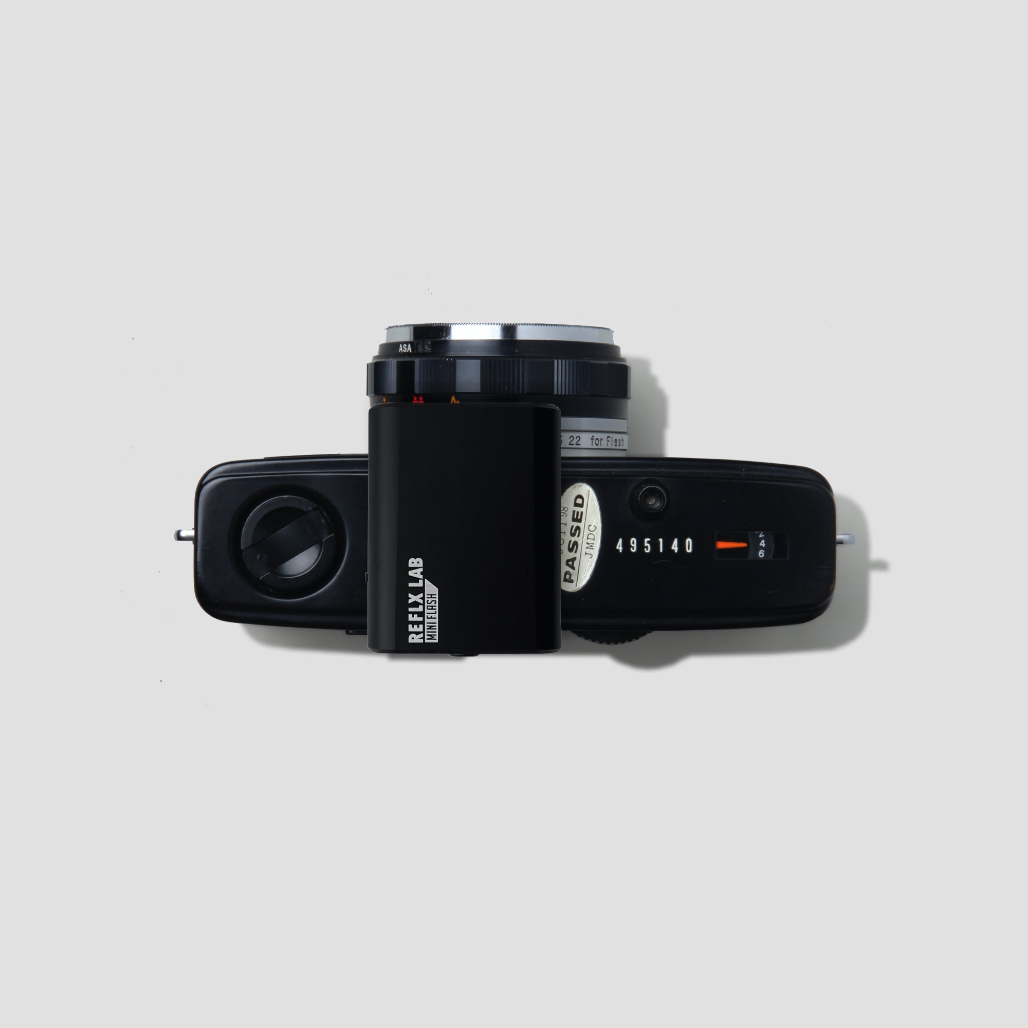 Reflx Mini Rechargeable Camera Flash with flash head extended for photography