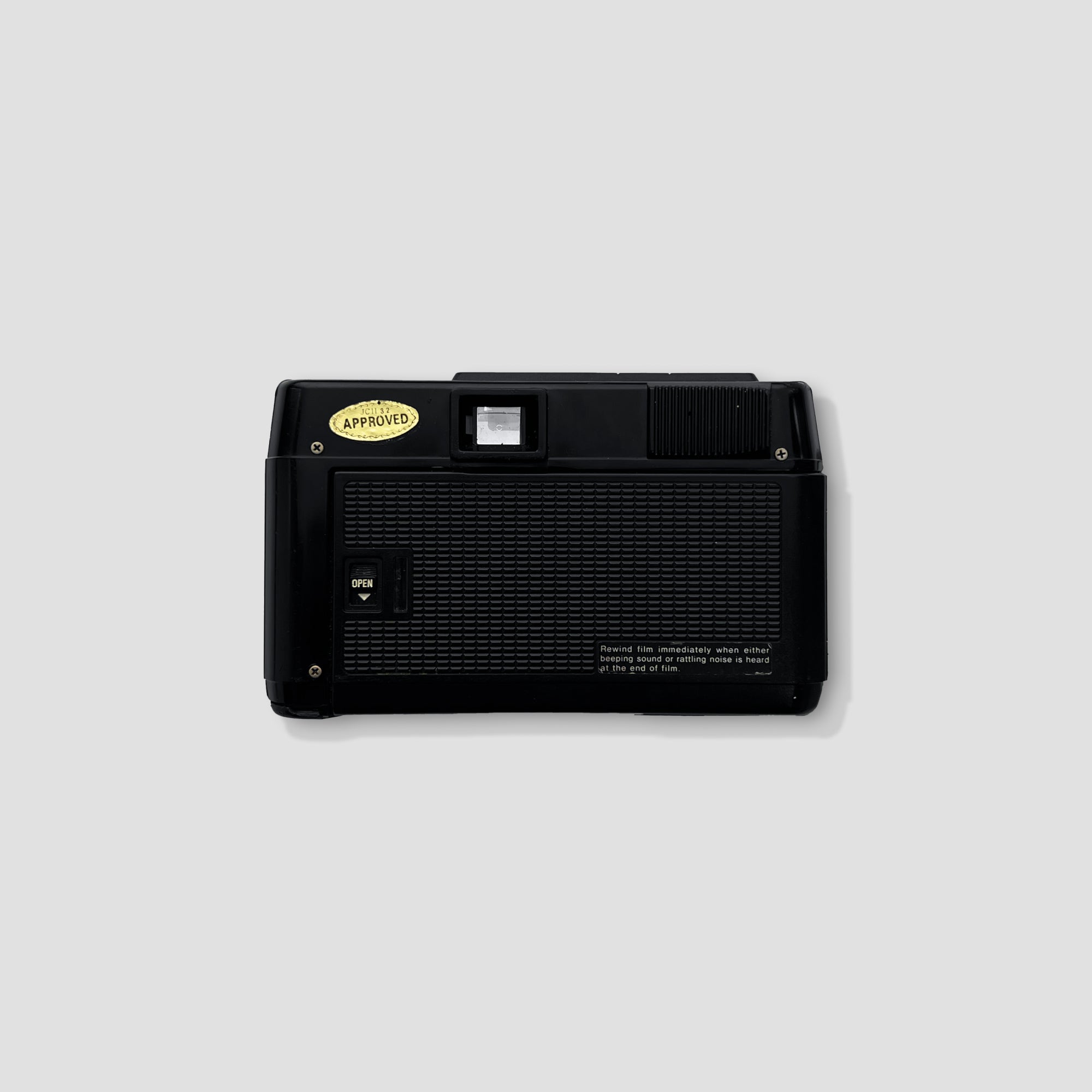 Close-up view of the Ricoh AF-5 lens, highlighting its 1:2.8 aperture and autofocus feature.