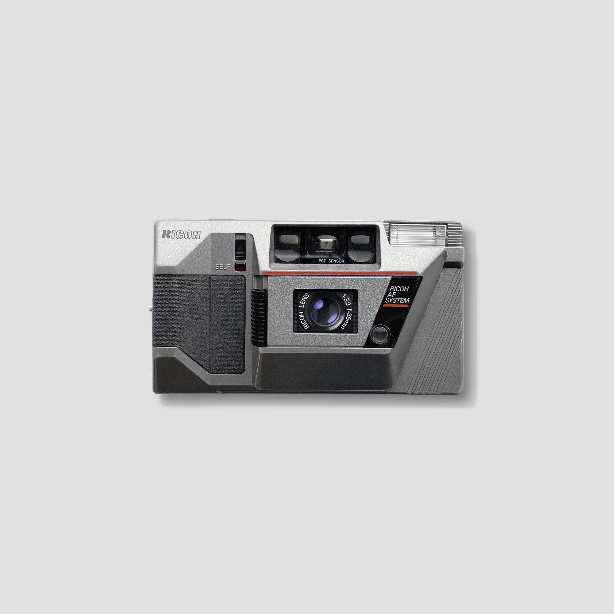 Front view of Ricoh AF-55 compact film camera showing its sleek design