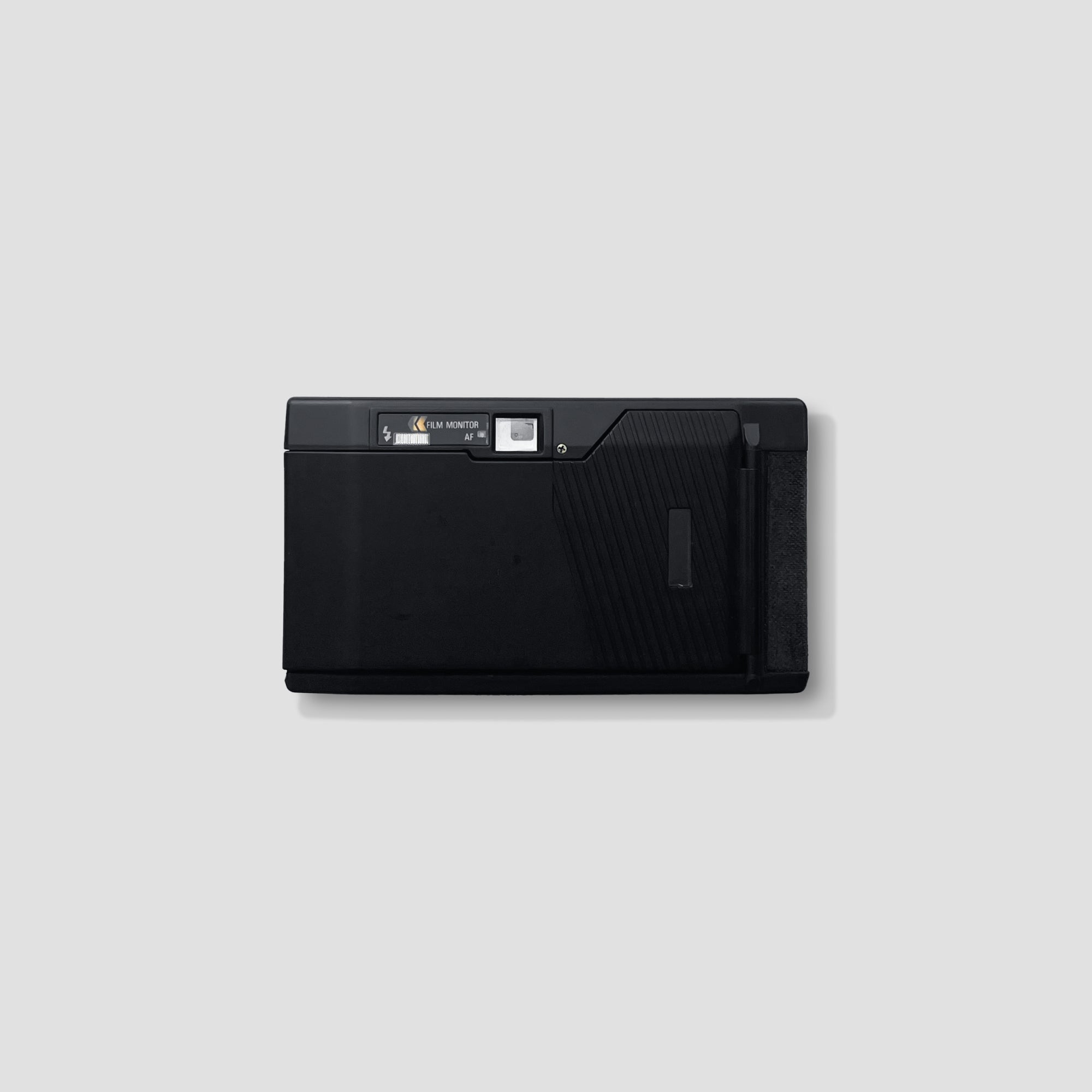 Ricoh AF 50 being held outdoors during a travel shoot — ideal for beginners
